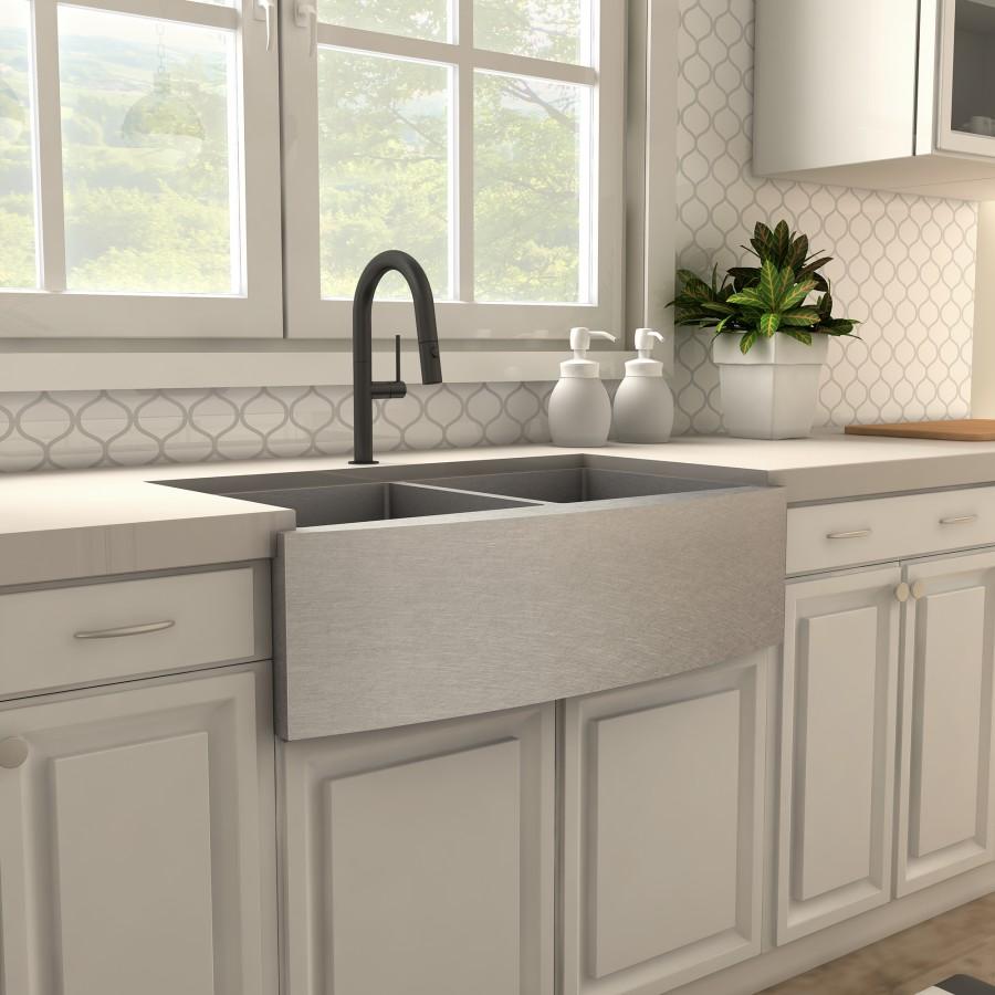 Matte black gooseneck kitchen faucet over single basin sink