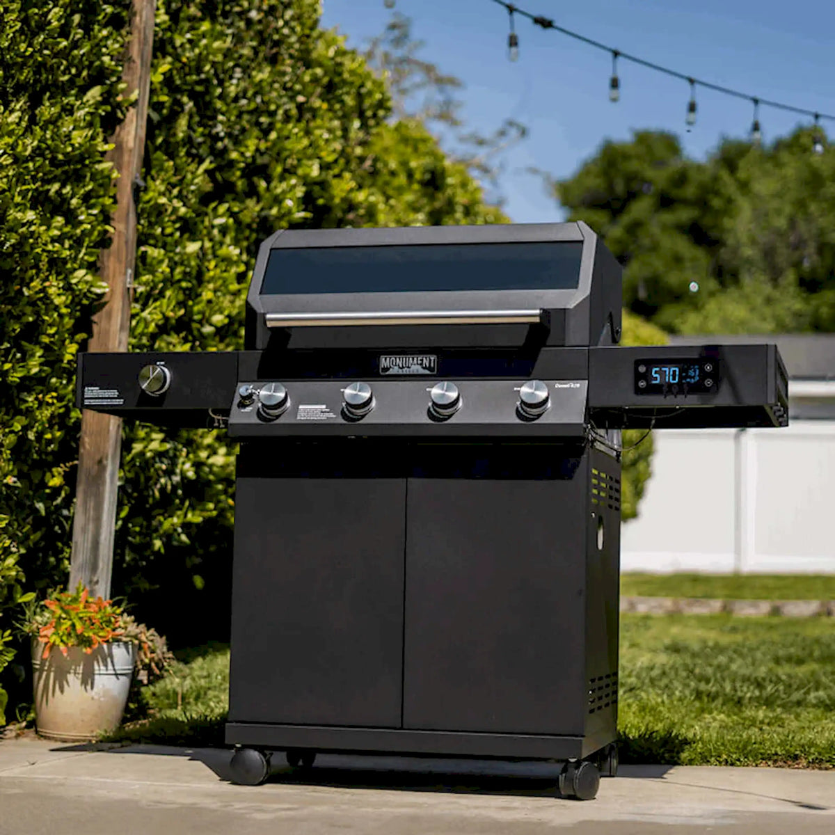 Monument Denali smart propane gas grill, black 4-burner design with closed lid