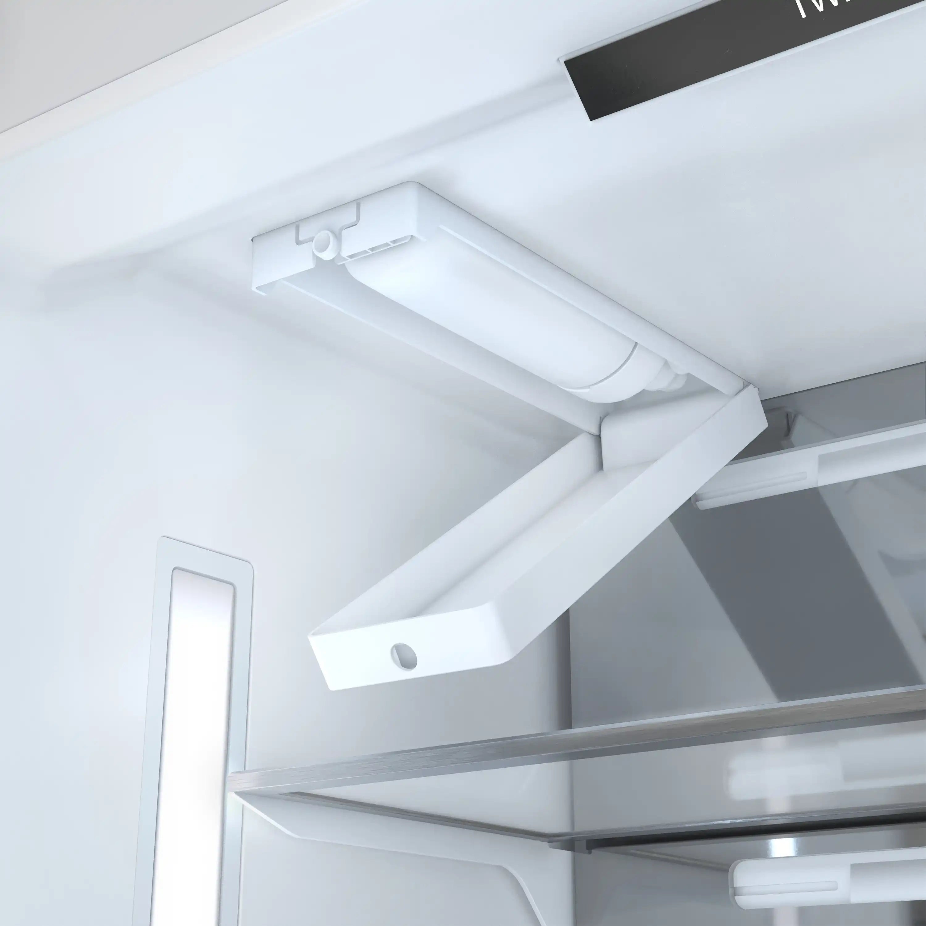 Freezer ceiling water/ice chute with white plastic housing and tubing