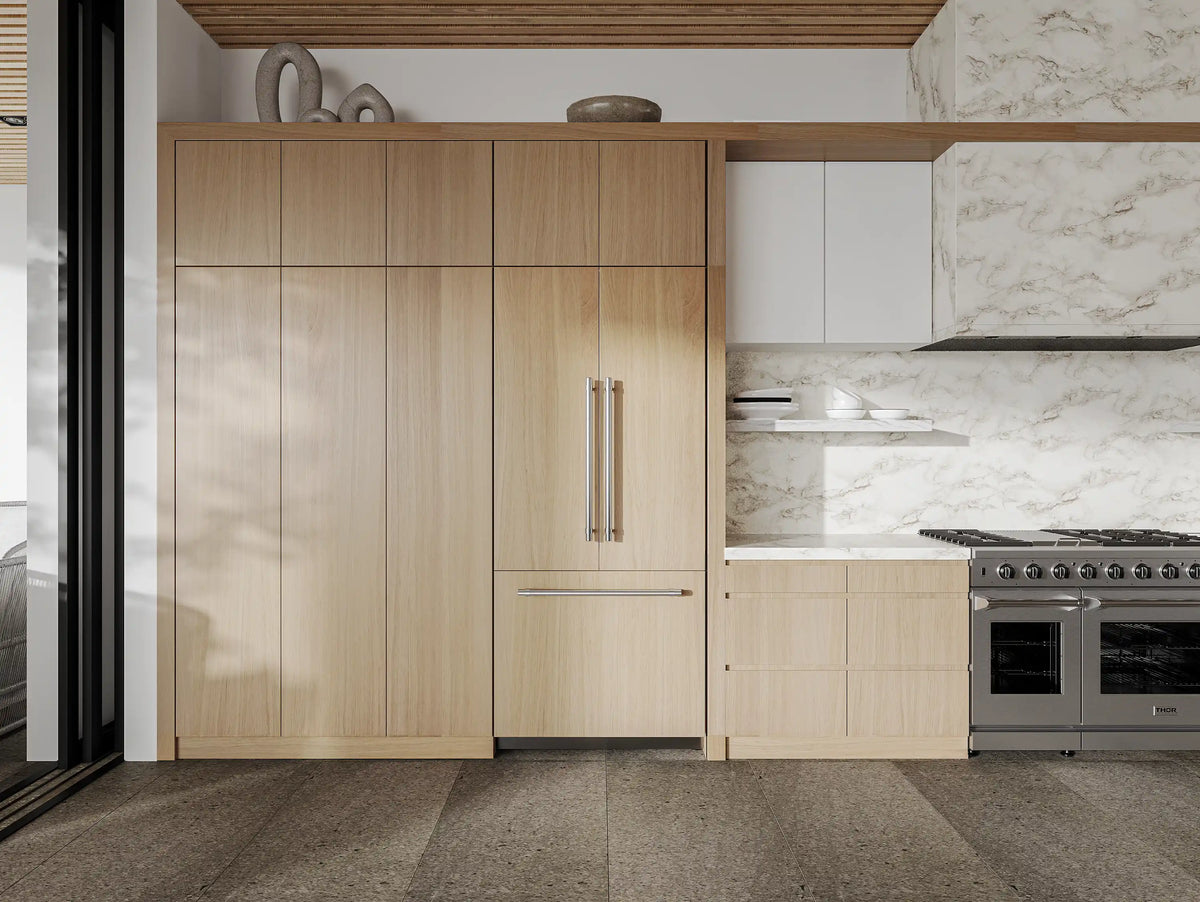 Panel-ready refrigerator built into kitchen cabinetry with matching wood-look doors closed