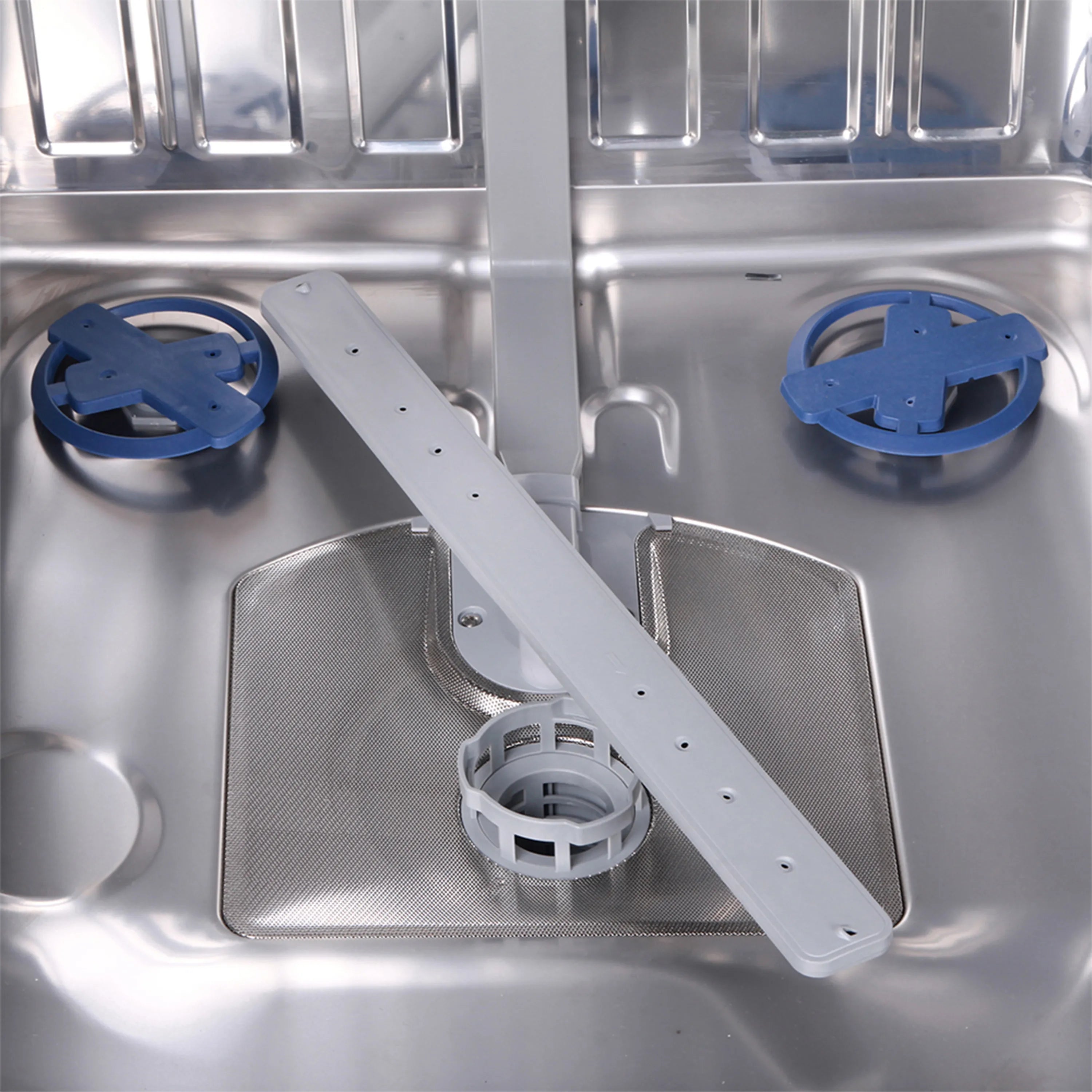 Dishwasher interior with stainless spray arm and blue filter components