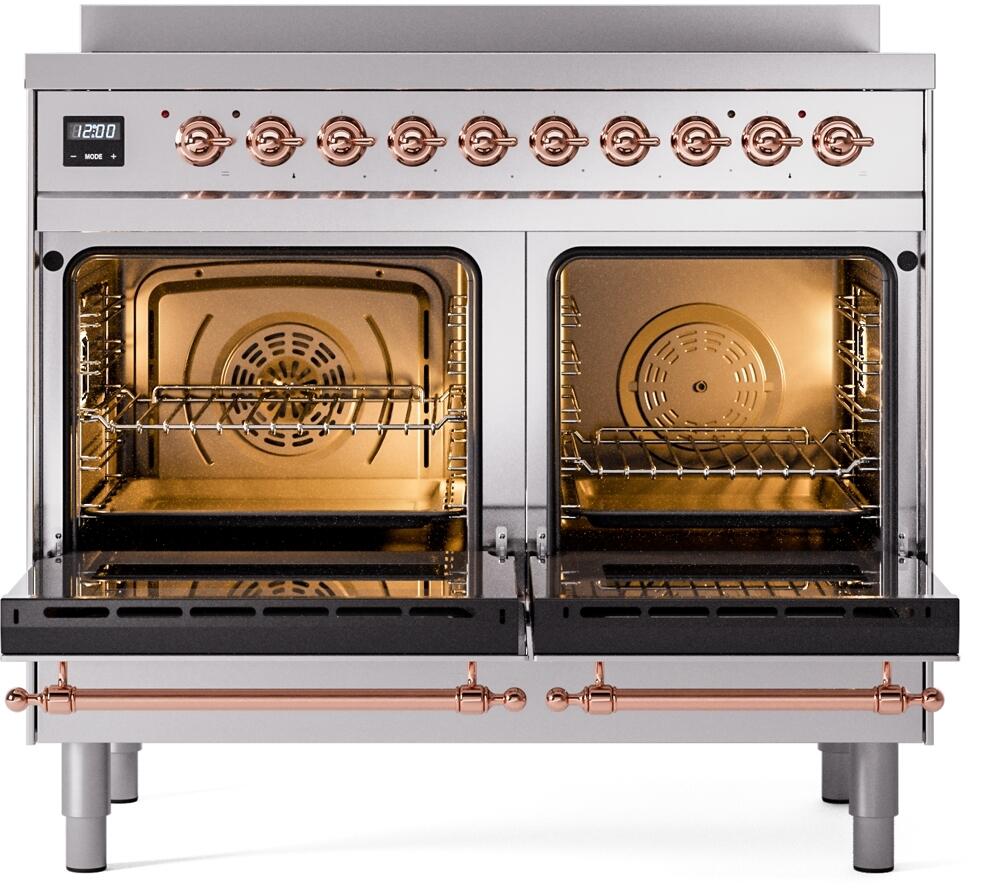 Freestanding induction range with two open ovens, racks inside, and copper trim accents