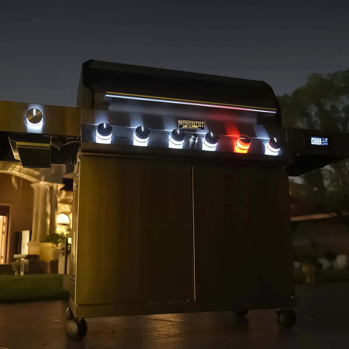 Outdoor propane gas grill with illuminated control panel and front burner glow