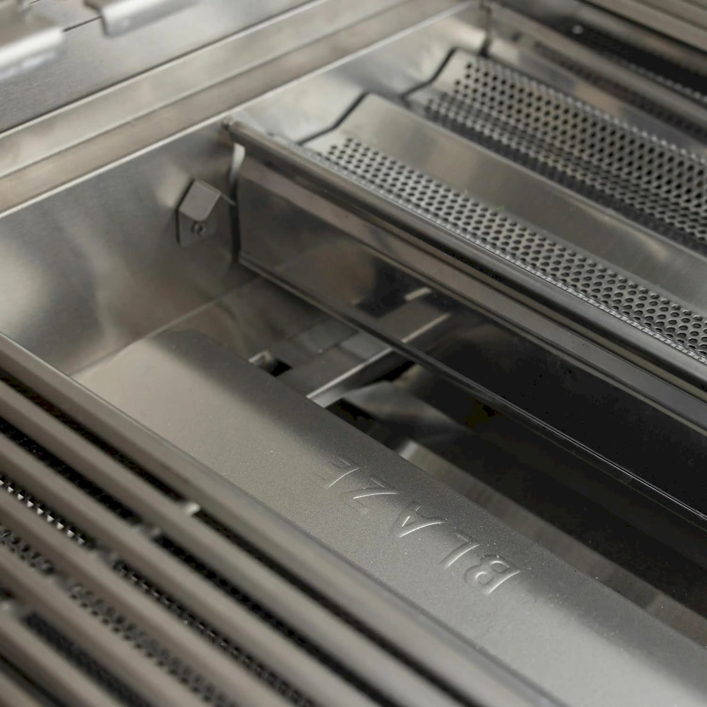 Stainless steel grill firebox with perforated infrared burner cover