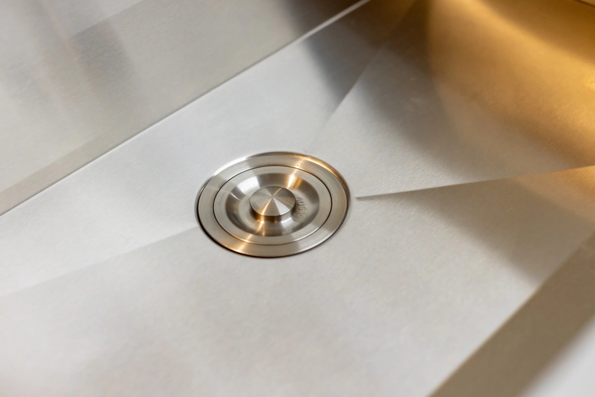 Farmhouse sink drain strainer with brushed metal cover