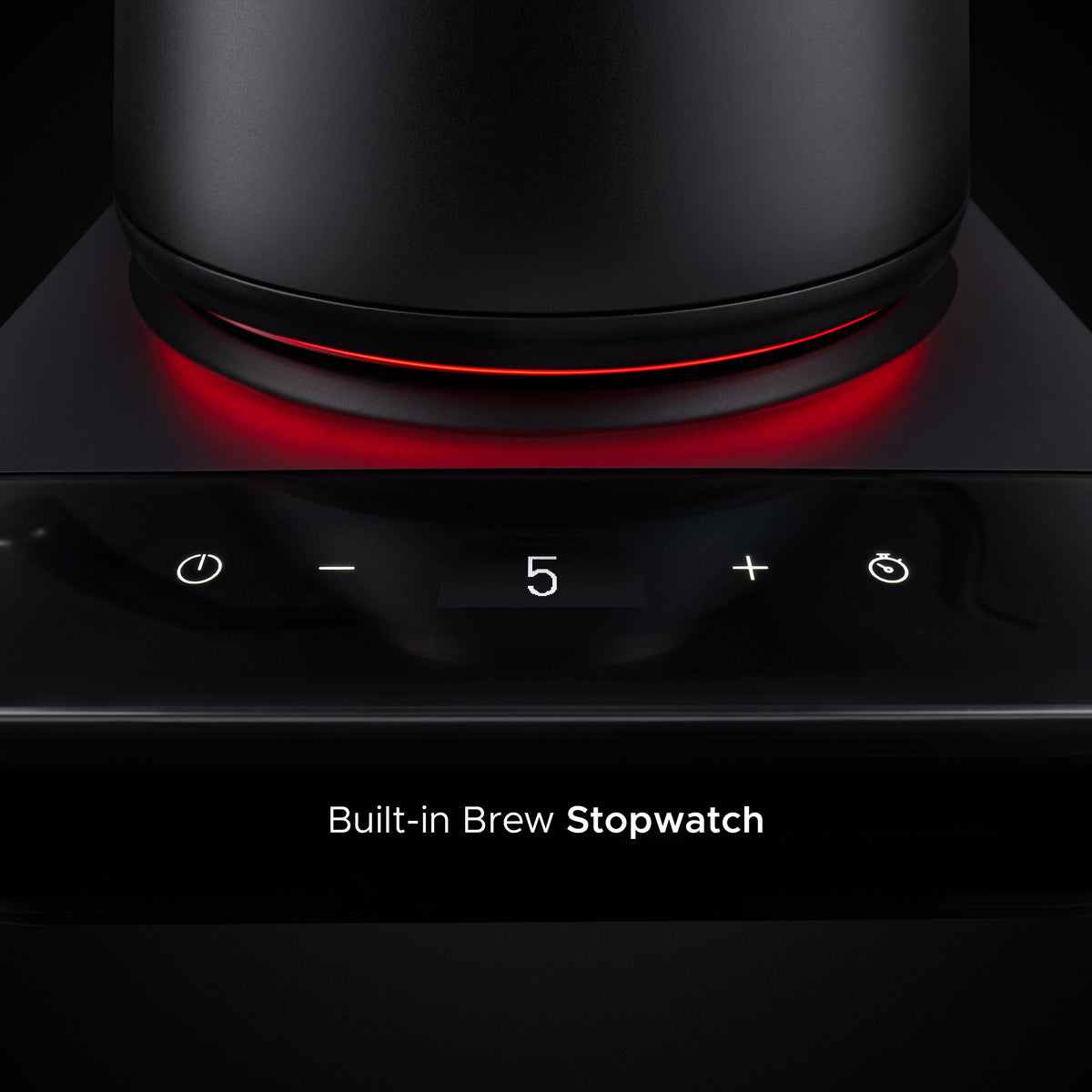 Matte black kettle base with glowing red heating ring and touch controls