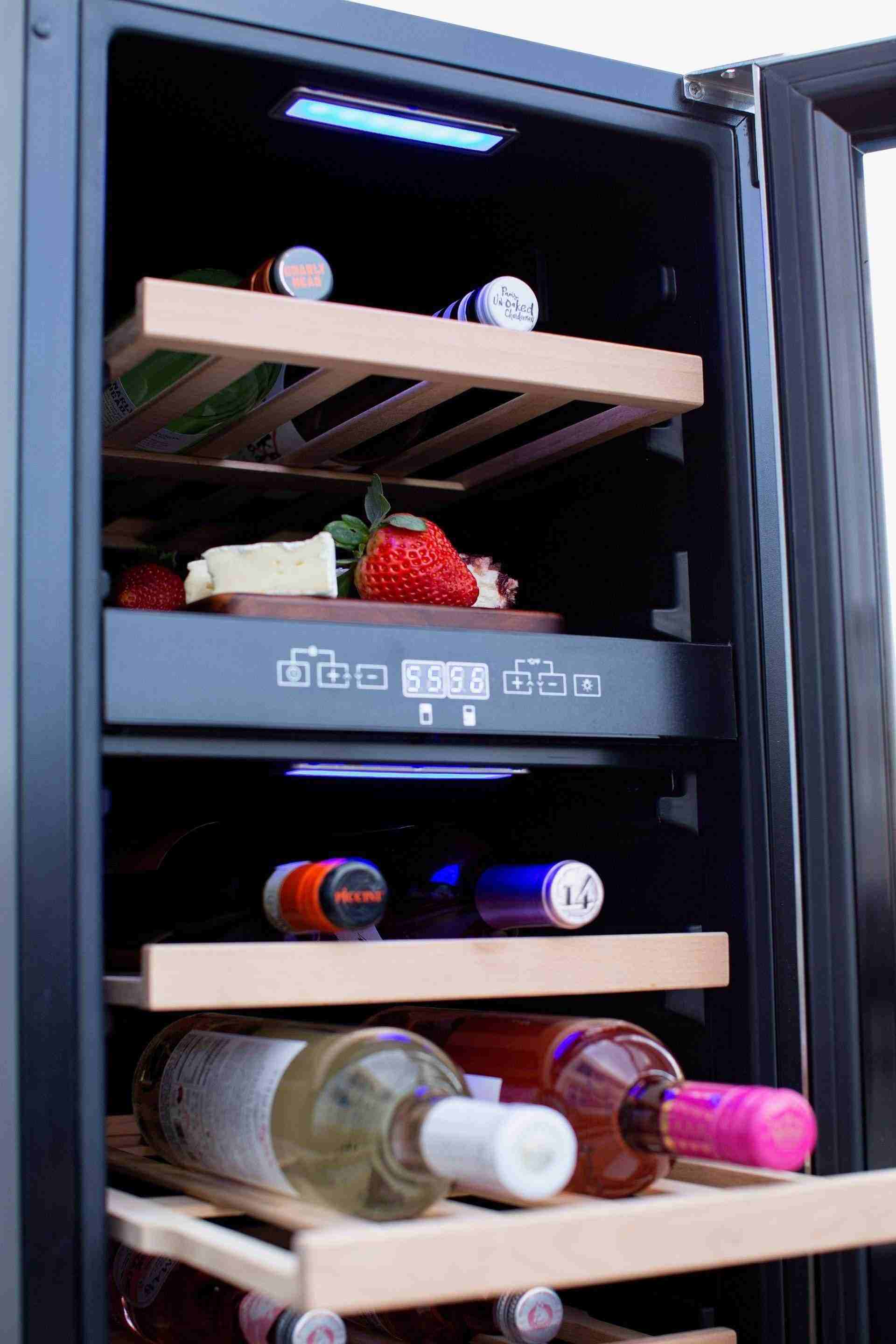 Wine cooler interior close-up with wooden racks, bottles, and blue LED lighting