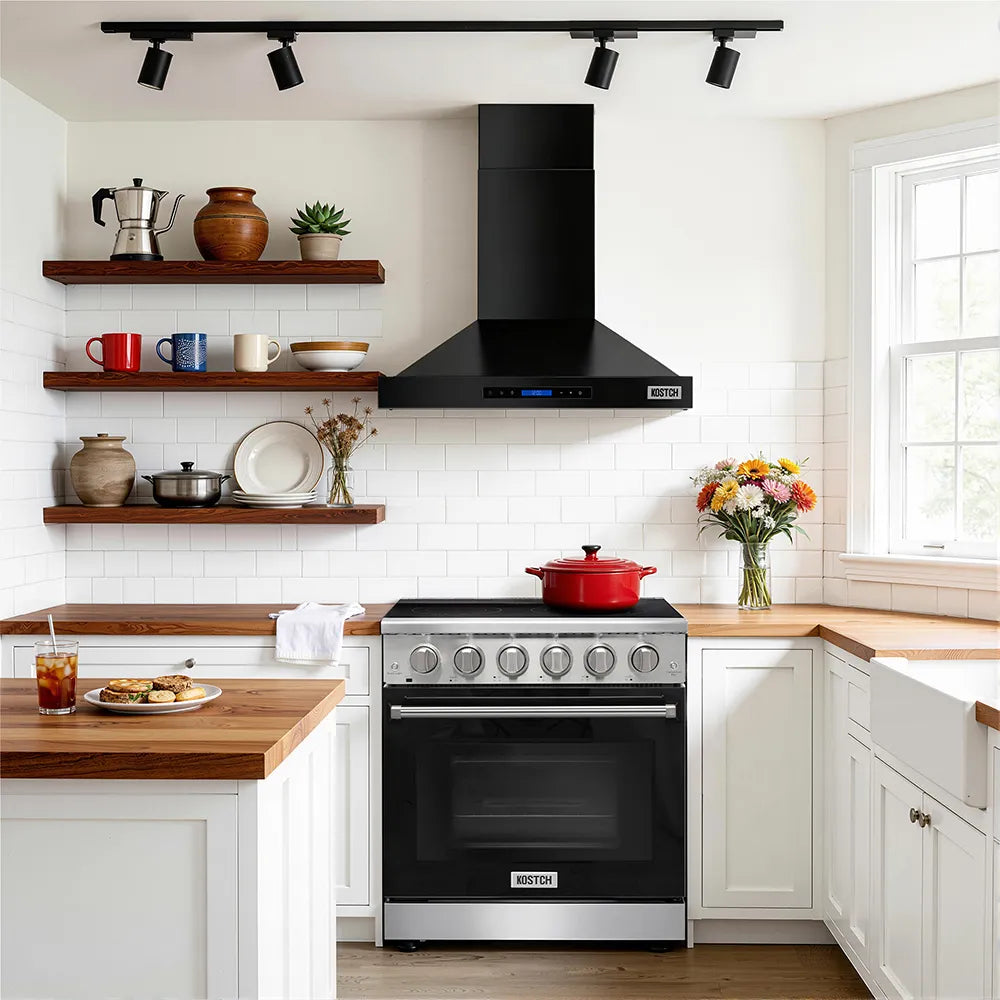 Black convertible wall-mounted range hood above a stove in a white kitchen