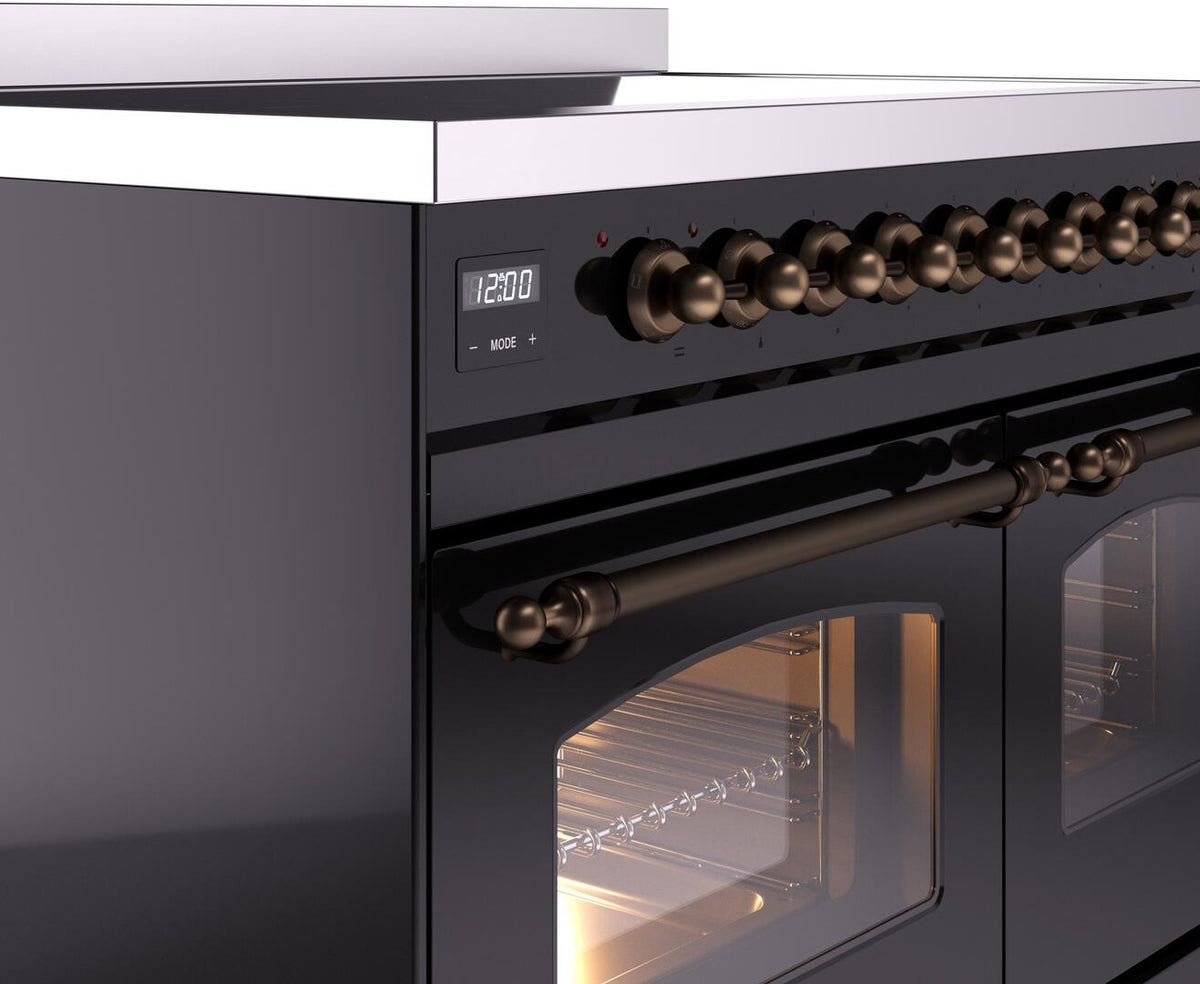 Glossy black induction range with bronze control knobs and oven door