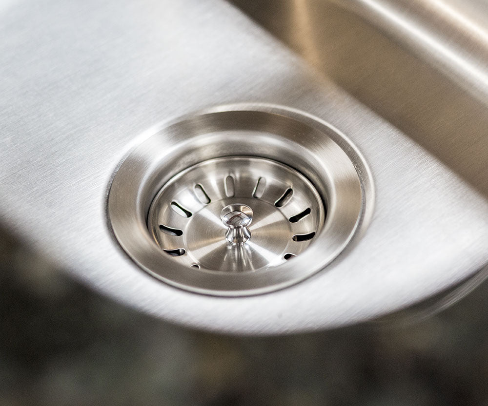 Stainless steel sink drain with perforated strainer and center cap
