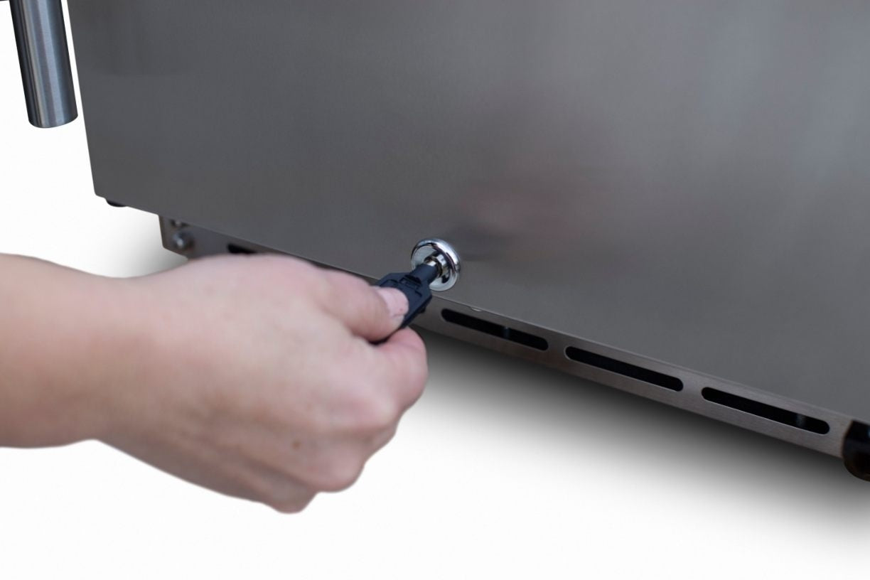 Outdoor refrigerator with control knob being turned by hand