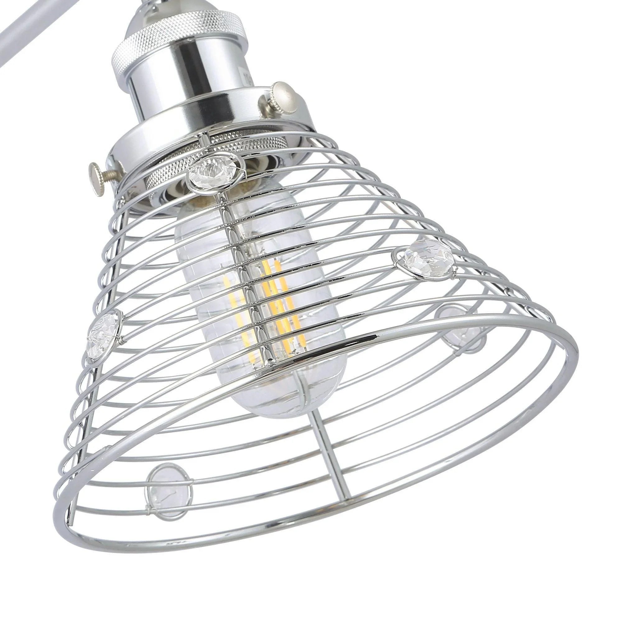 Close-up of silver wire cage wall sconce shade with exposed glass bulb and socket