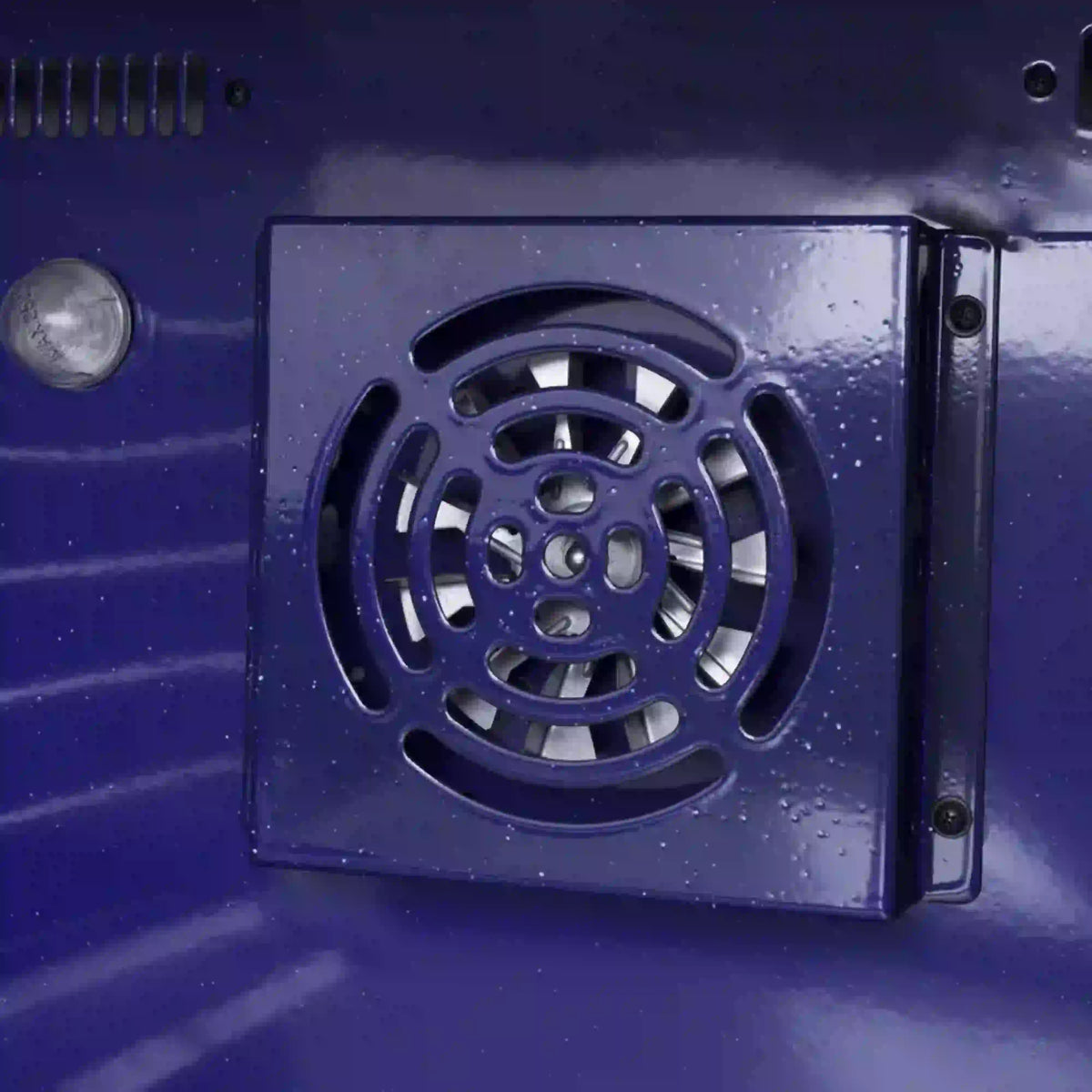 Blue range interior ventilation fan cover with circular openings