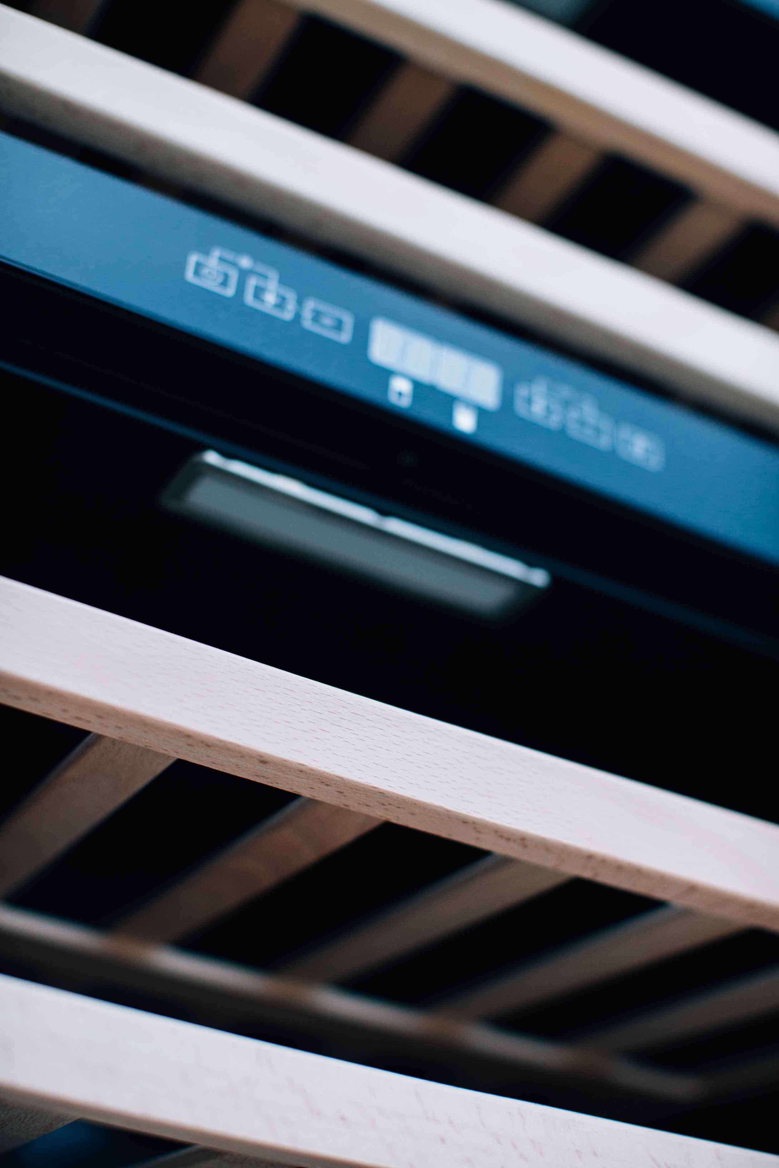 Wine cooler control panel with digital display and touch buttons on the inner frame