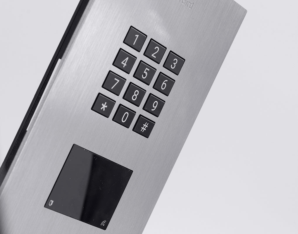 Close-up of titanium keypad with 0-9 buttons, star, hash, and dark display area