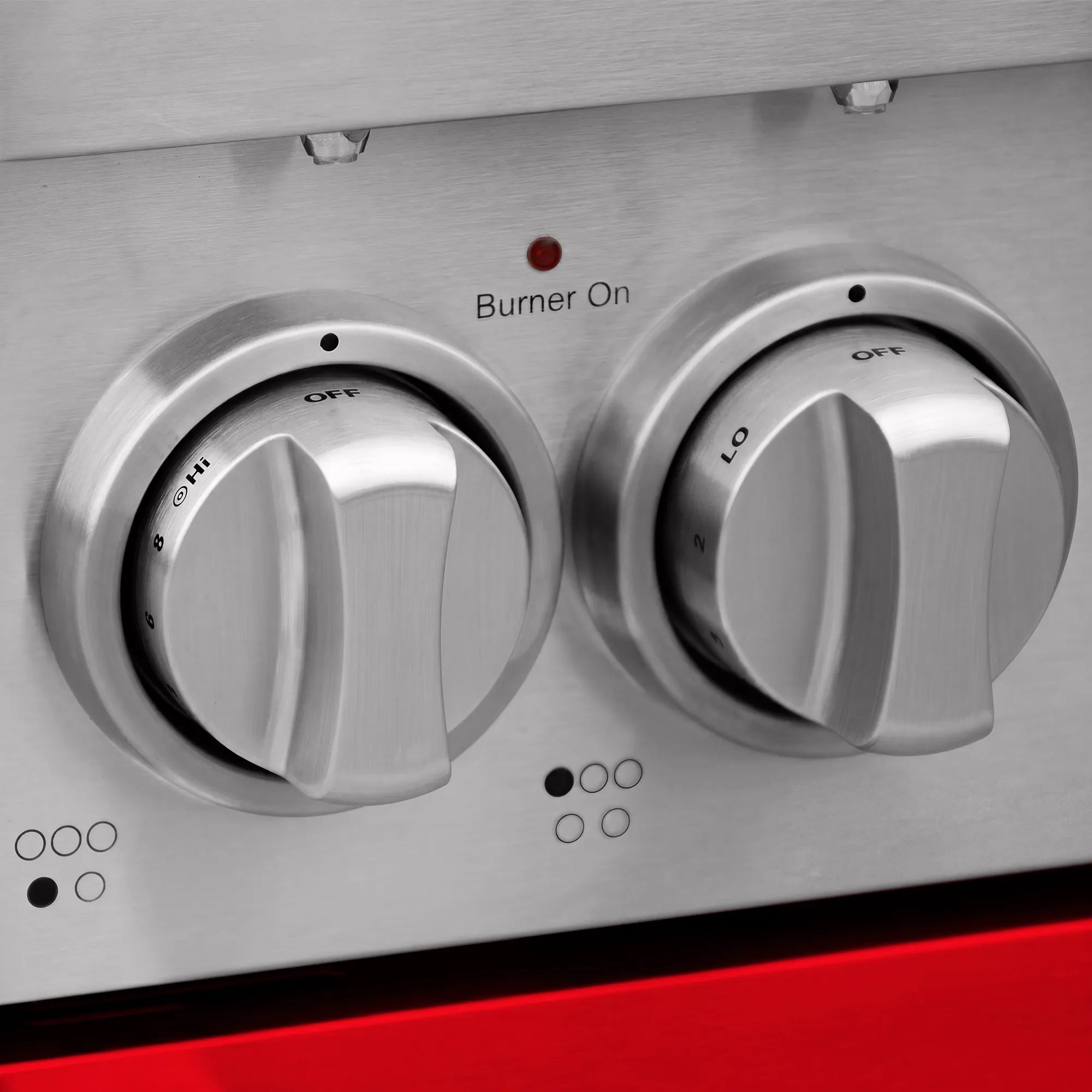 Stainless electric range control panel with large burner knobs and Burner On indicator