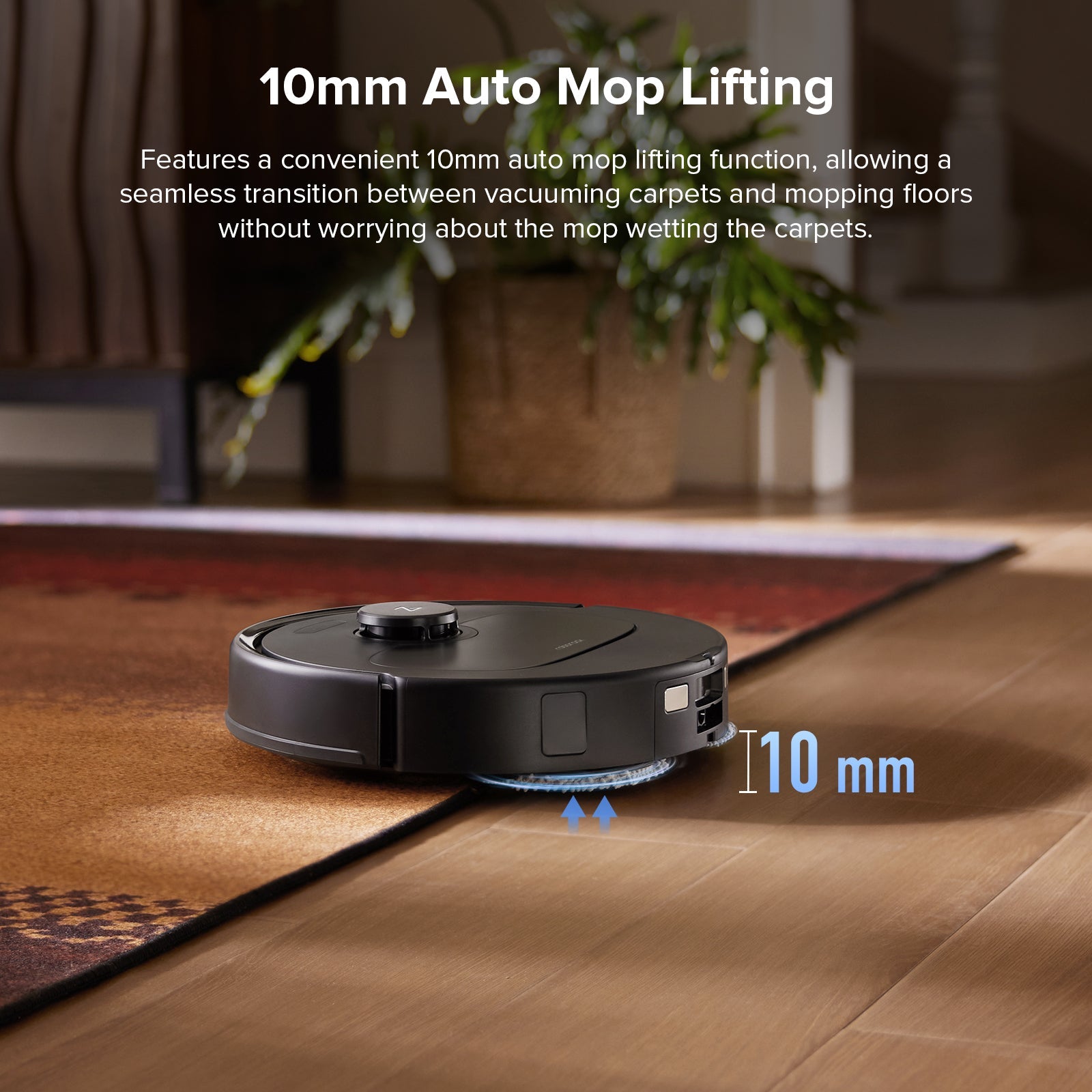 Black robot vacuum on wood floor with 10mm auto mop lifting visible on front