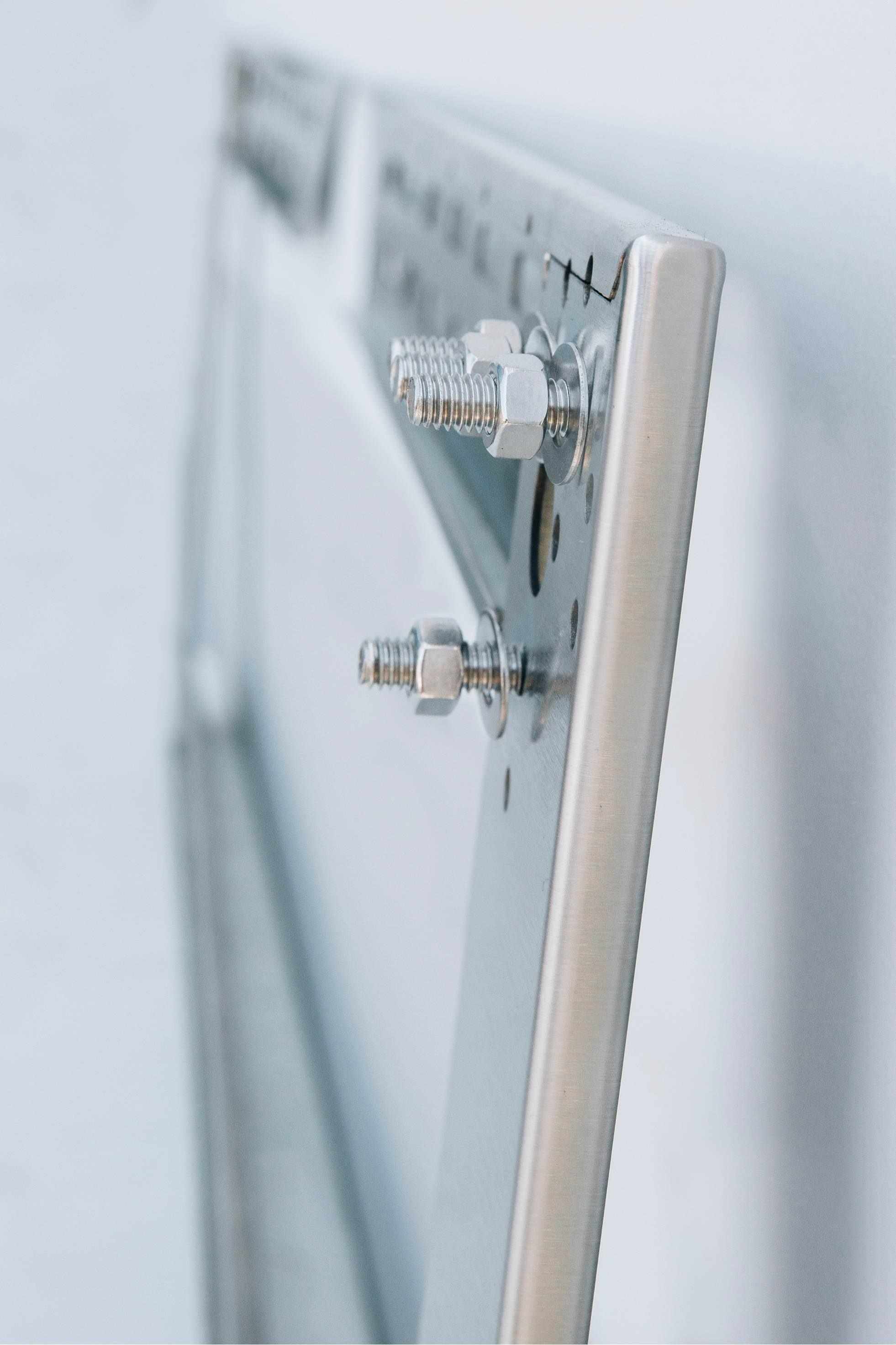 Stainless steel mounting bracket with adjustable bolts and screws