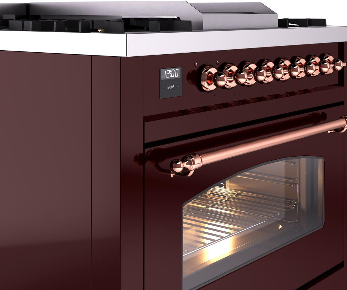 Burgundy range side view with copper knob row and stainless oven door window
