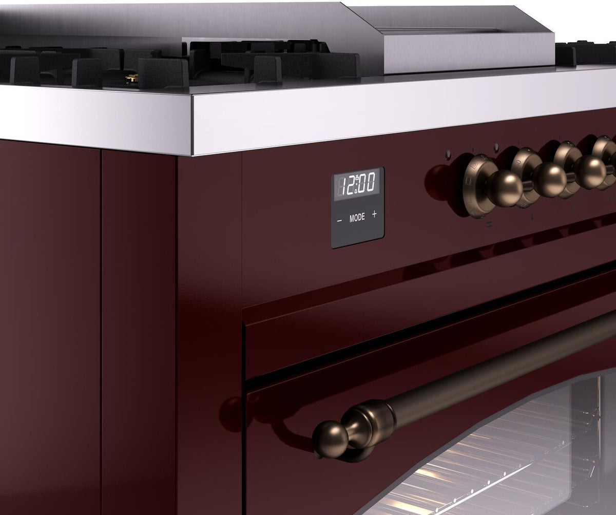 Burgundy ILVE range control panel with digital display and bronze knobs and handle