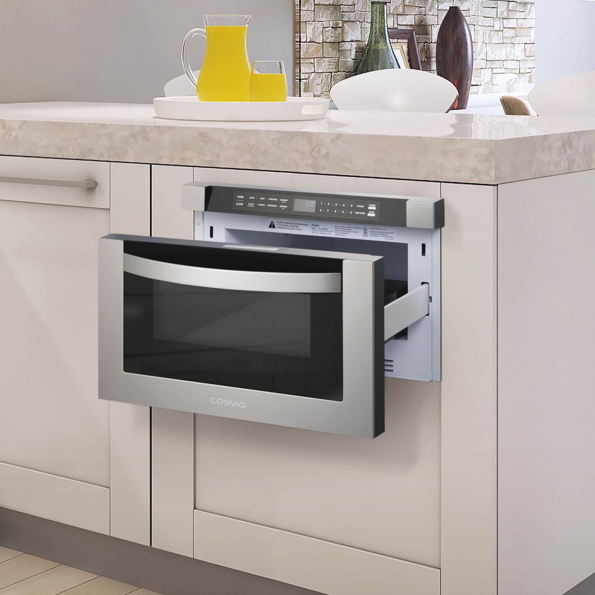 Built-in stainless steel microwave drawer installed in cabinetry with door open