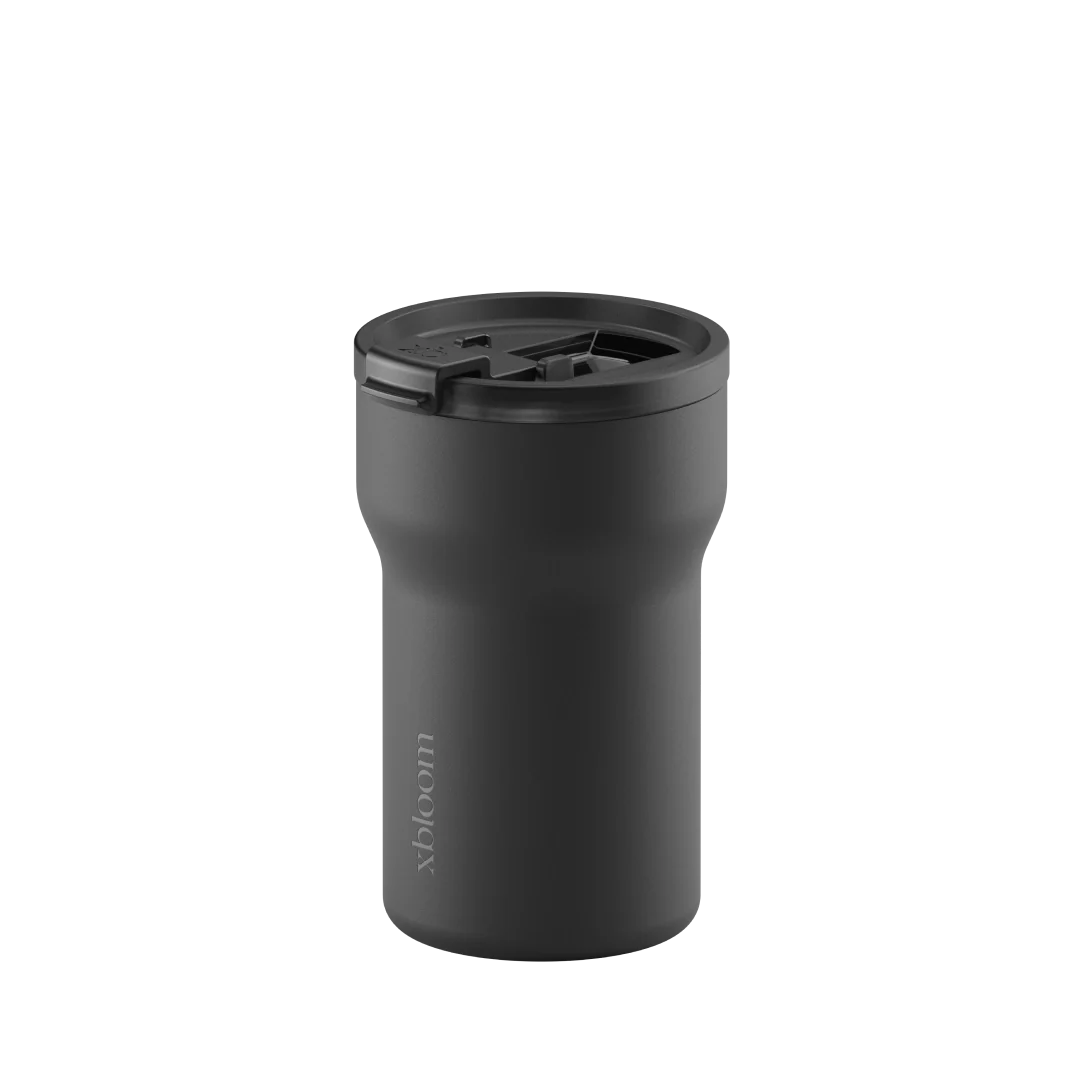 Charcoal black passenger tumbler lid close-up with flip-top latch