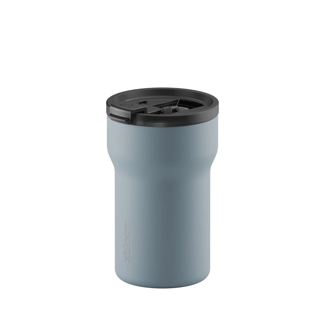 Glacier blue xBloom passenger tumbler with open lid, black drinking opening