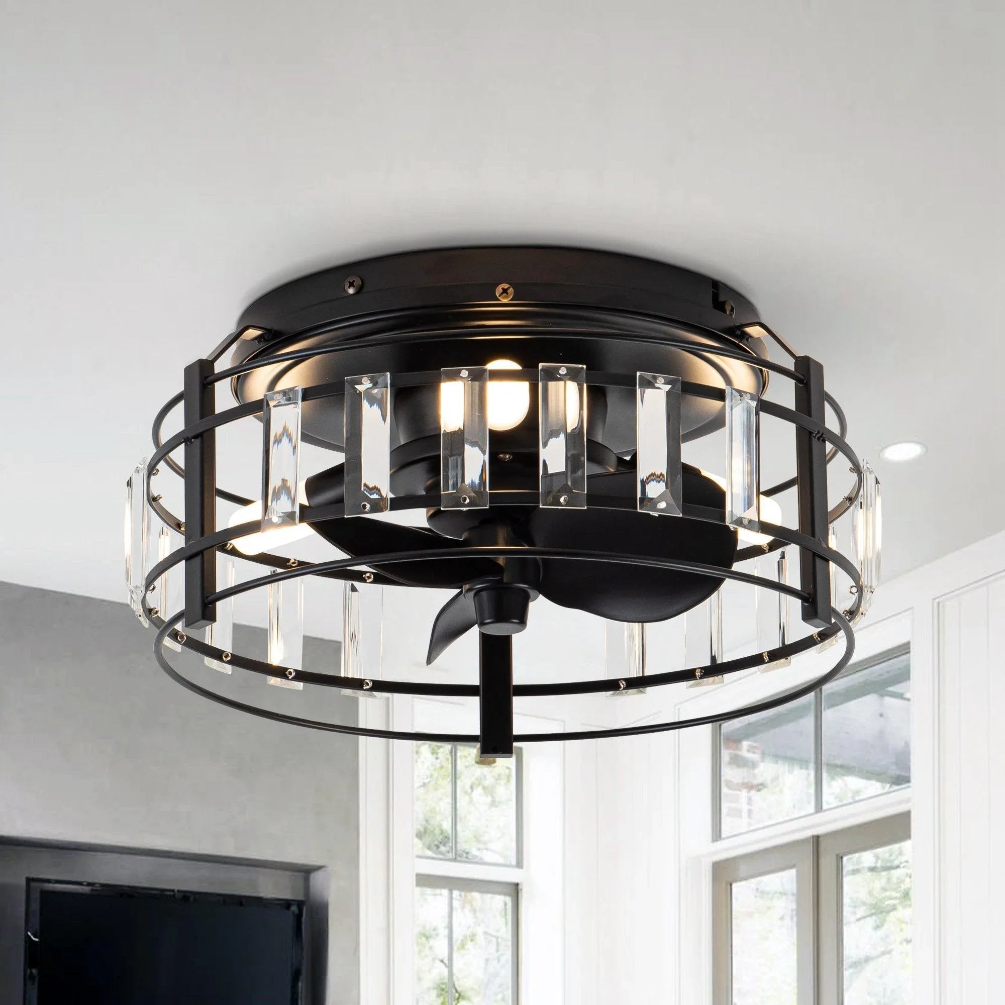 Black flush-mount ceiling fan with clear crystal panels and integrated light