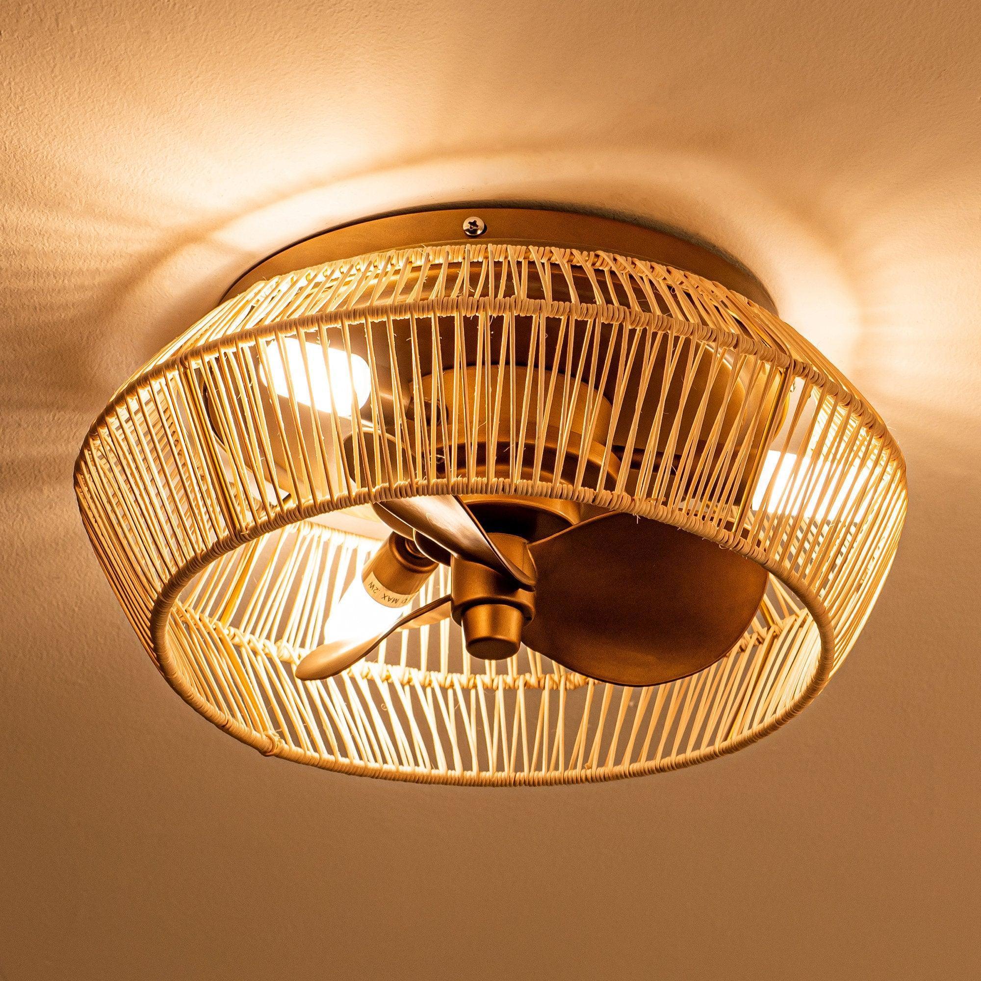 Golden flush-mount ceiling fan with rattan-style cage and three dark blades