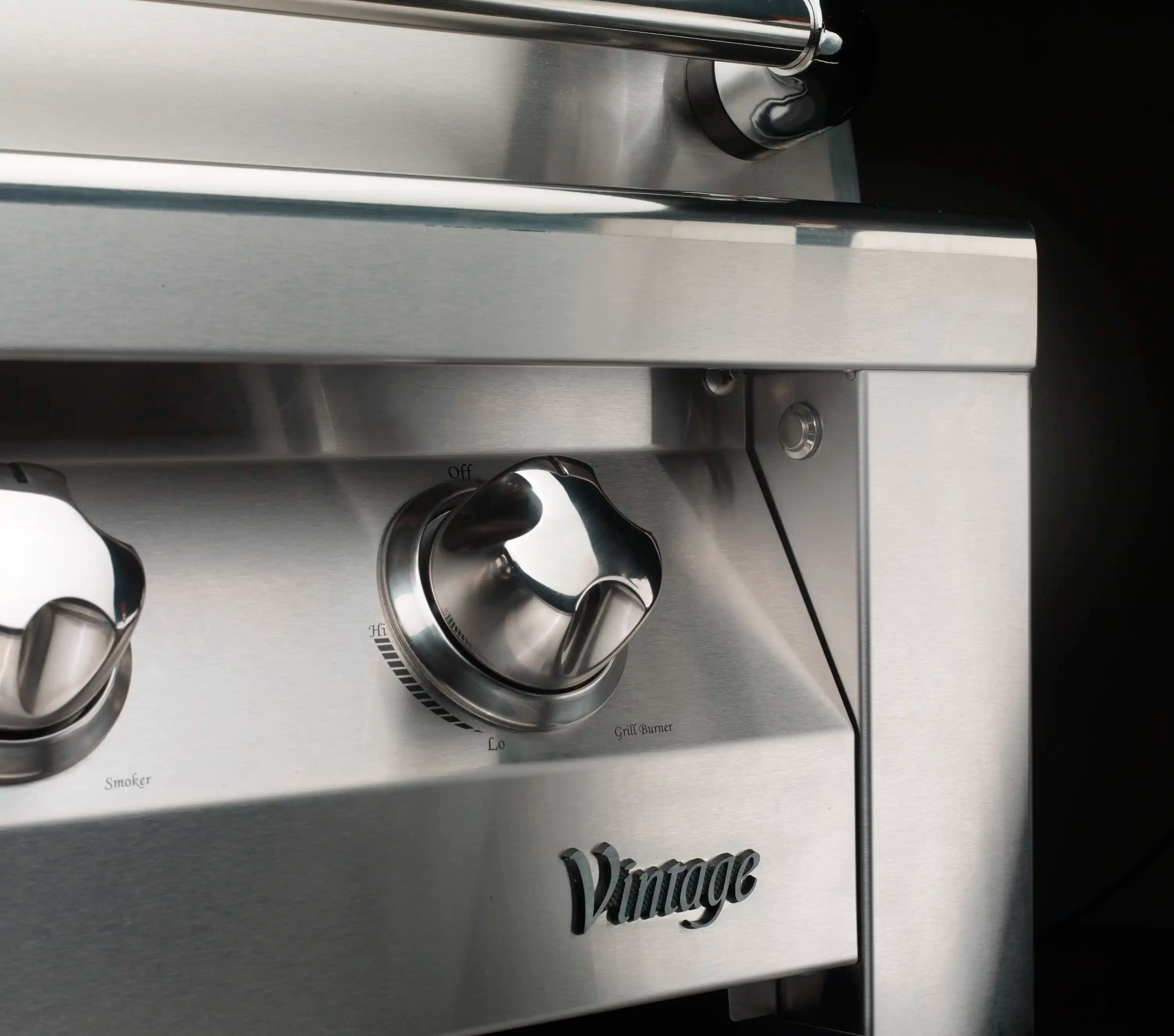 Stainless grill burner knobs and control dial on front panel
