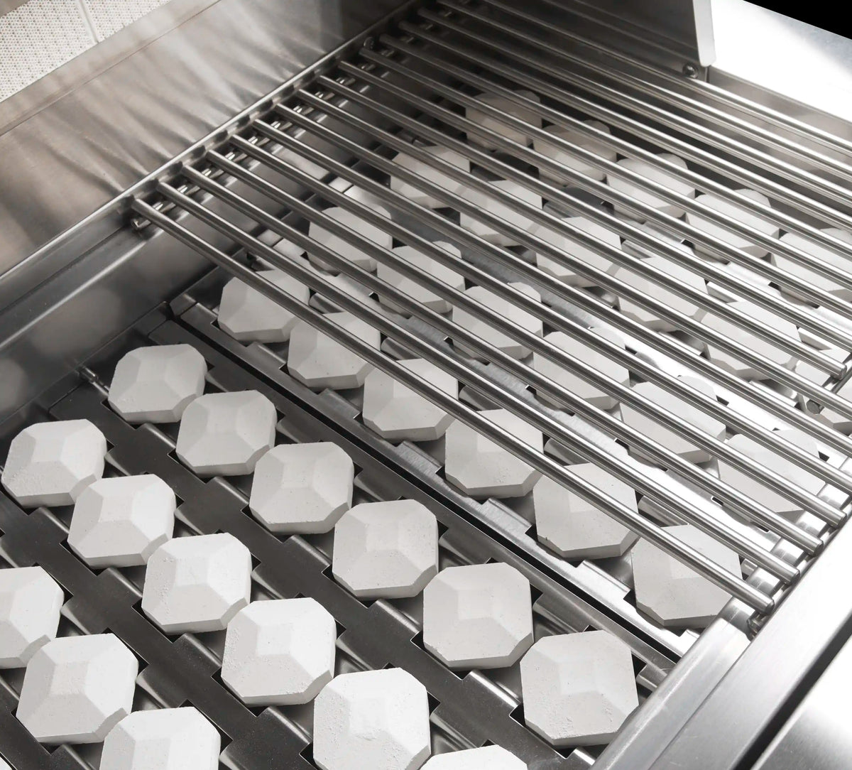 Stainless steel natural gas grill with slatted cooking grate and hex heat stones