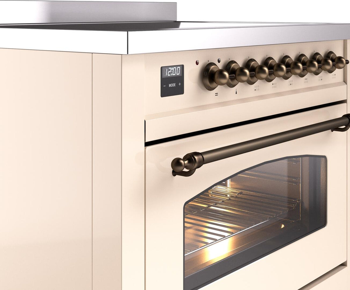 Antique white electric induction range with bronze knob controls, display, and oven door handle