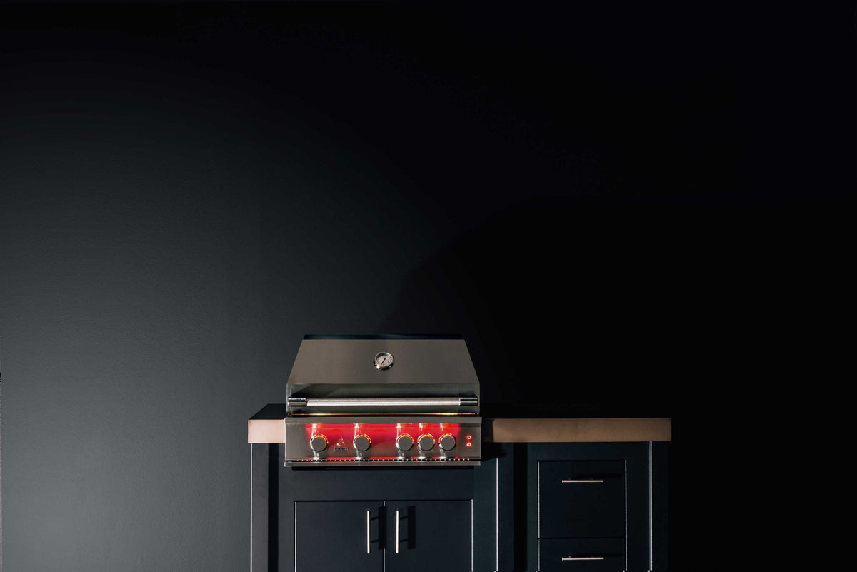 Stainless built-in propane gas grill with open lid and front control panel