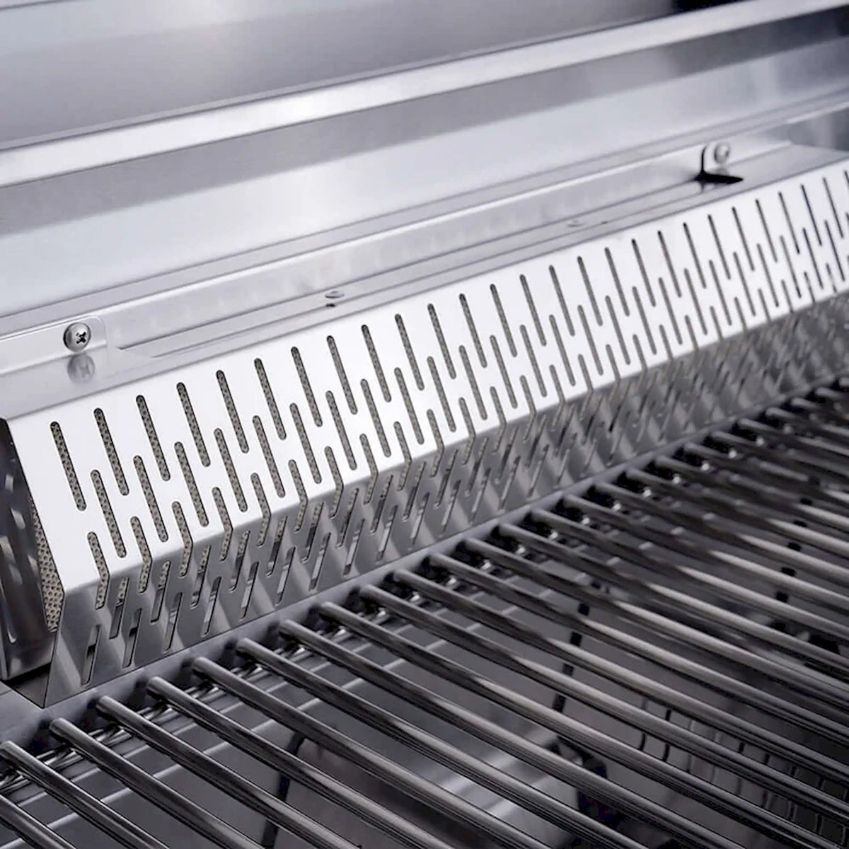 Close-up of stainless warming rack and grill grate bars inside the lid