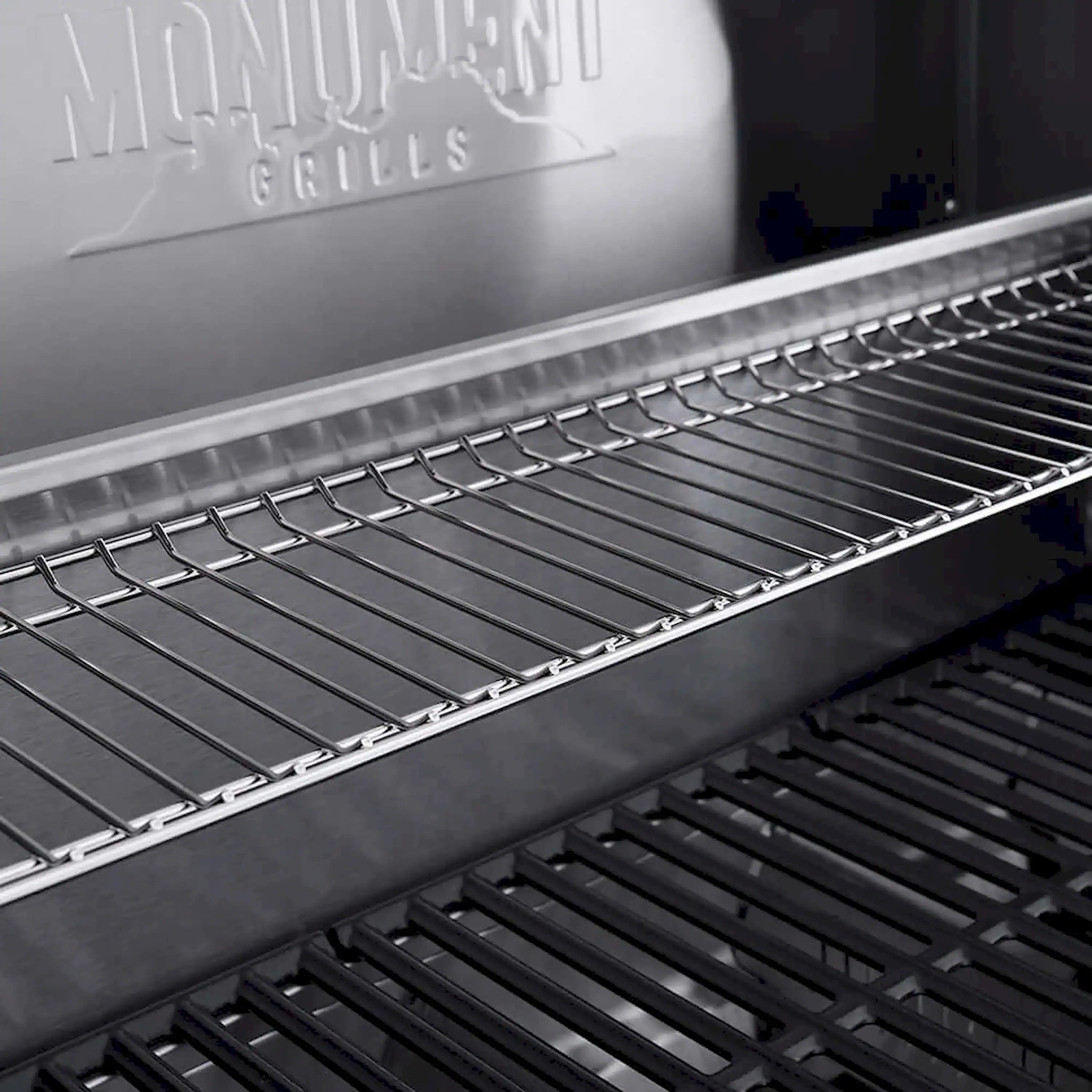 Stainless steel grill grates and warming area on a propane gas grill