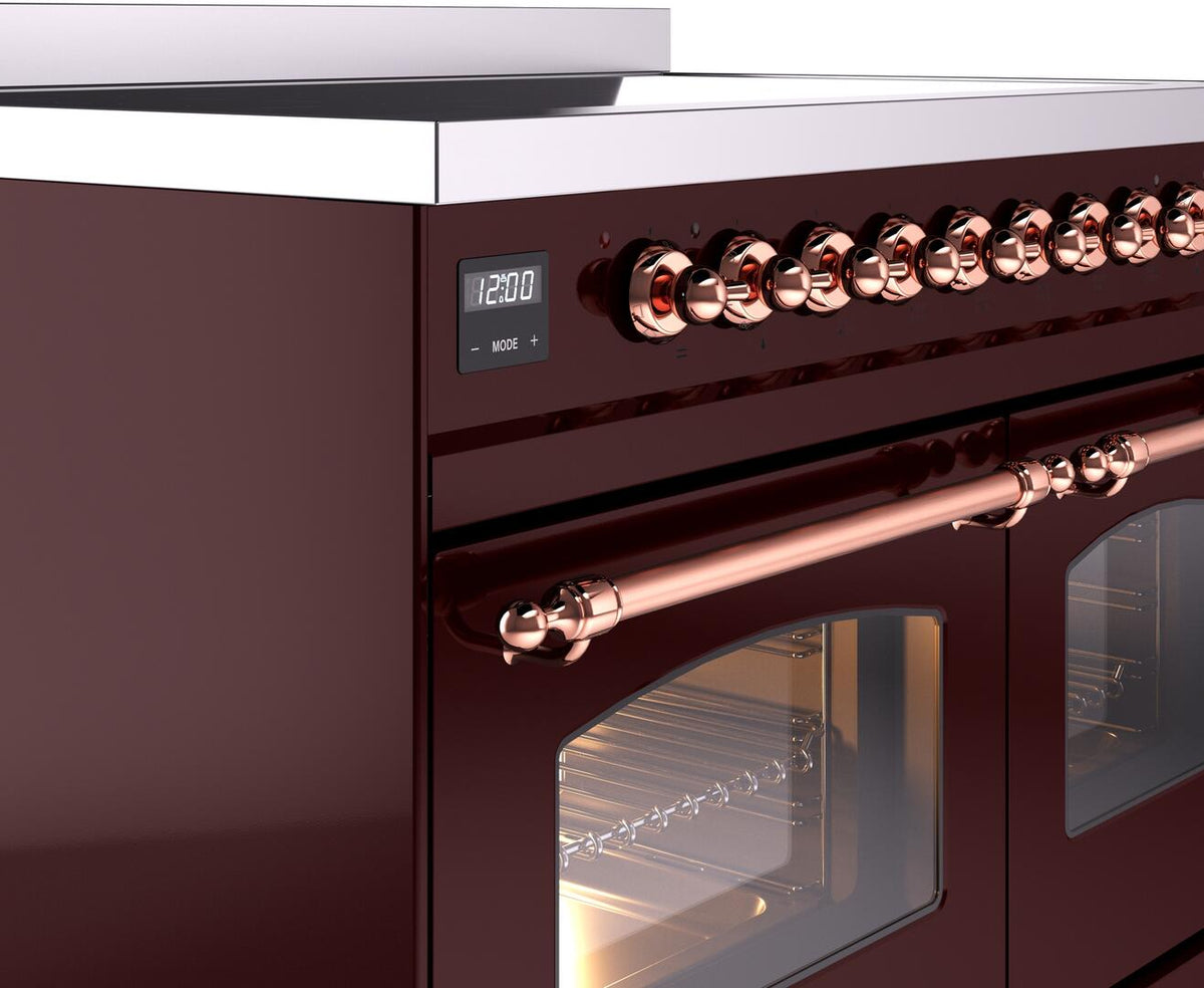 Burgundy induction range control knobs with copper accents and oven door handle