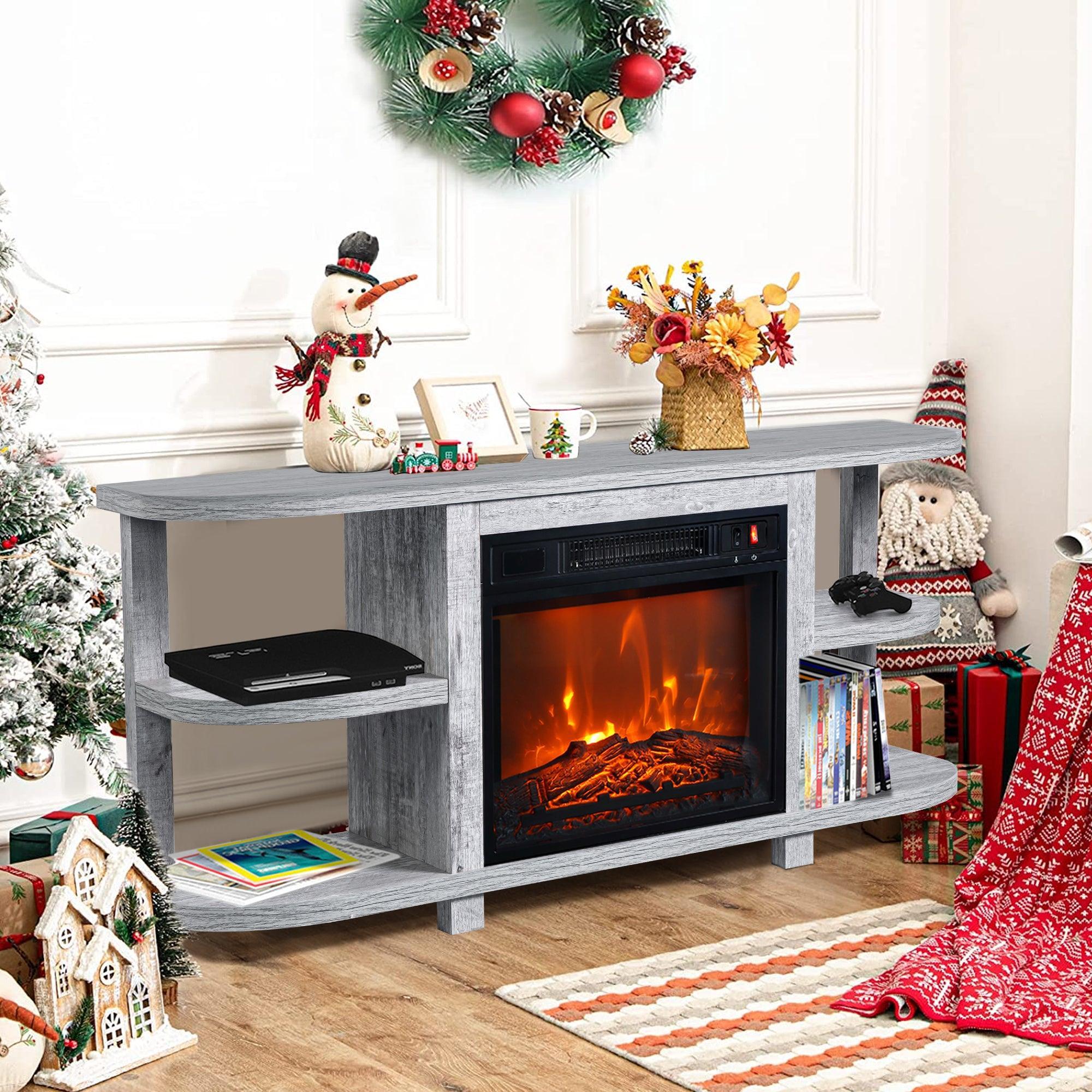Grey TV stand with electric fireplace insert, side shelves, and holiday decorations
