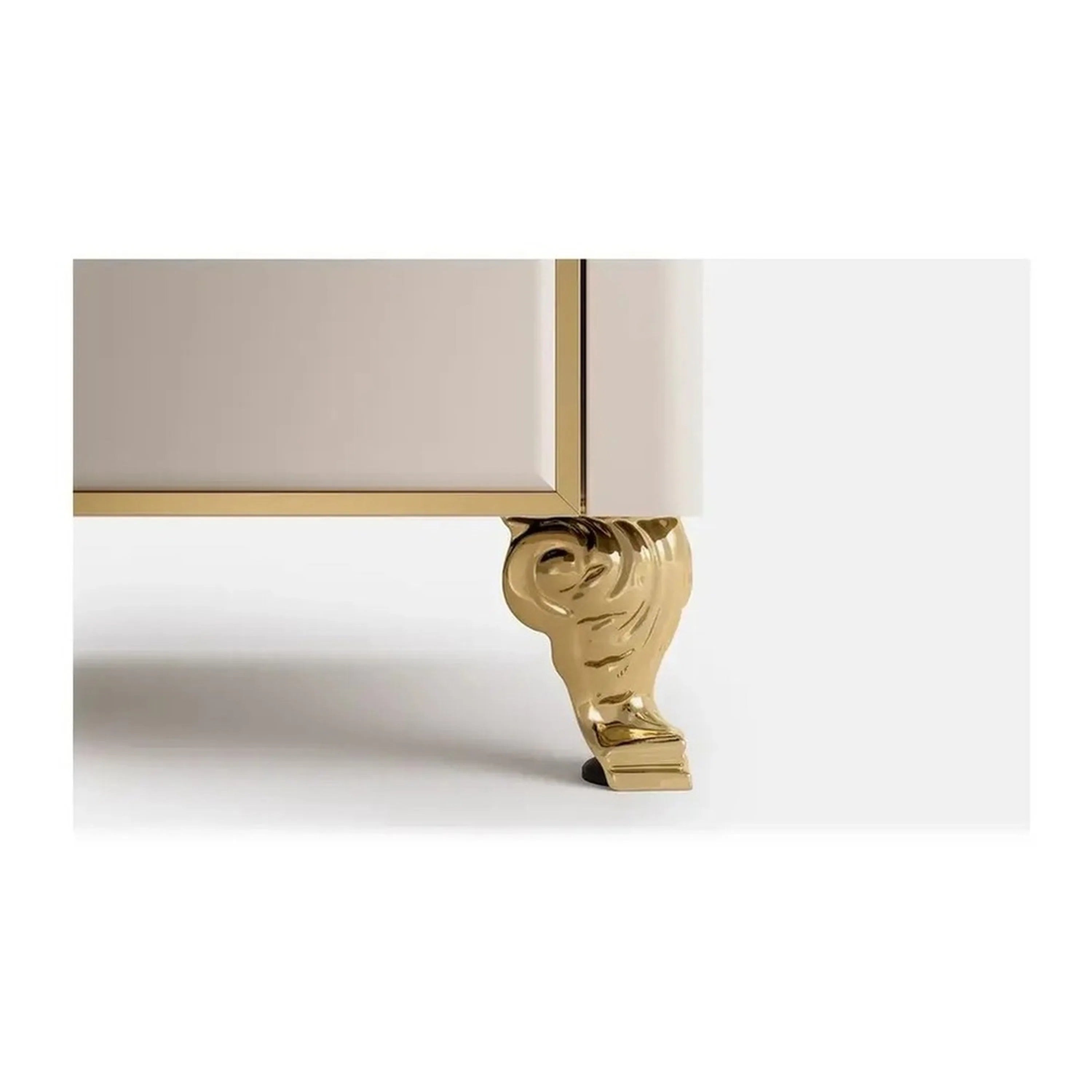 Brass scroll claw-style appliance foot with decorative scroll profile