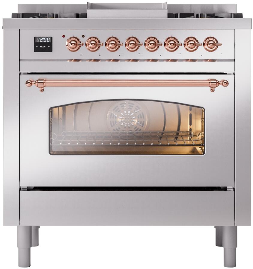 Freestanding range front with control knobs, copper bar handles, and glass oven window