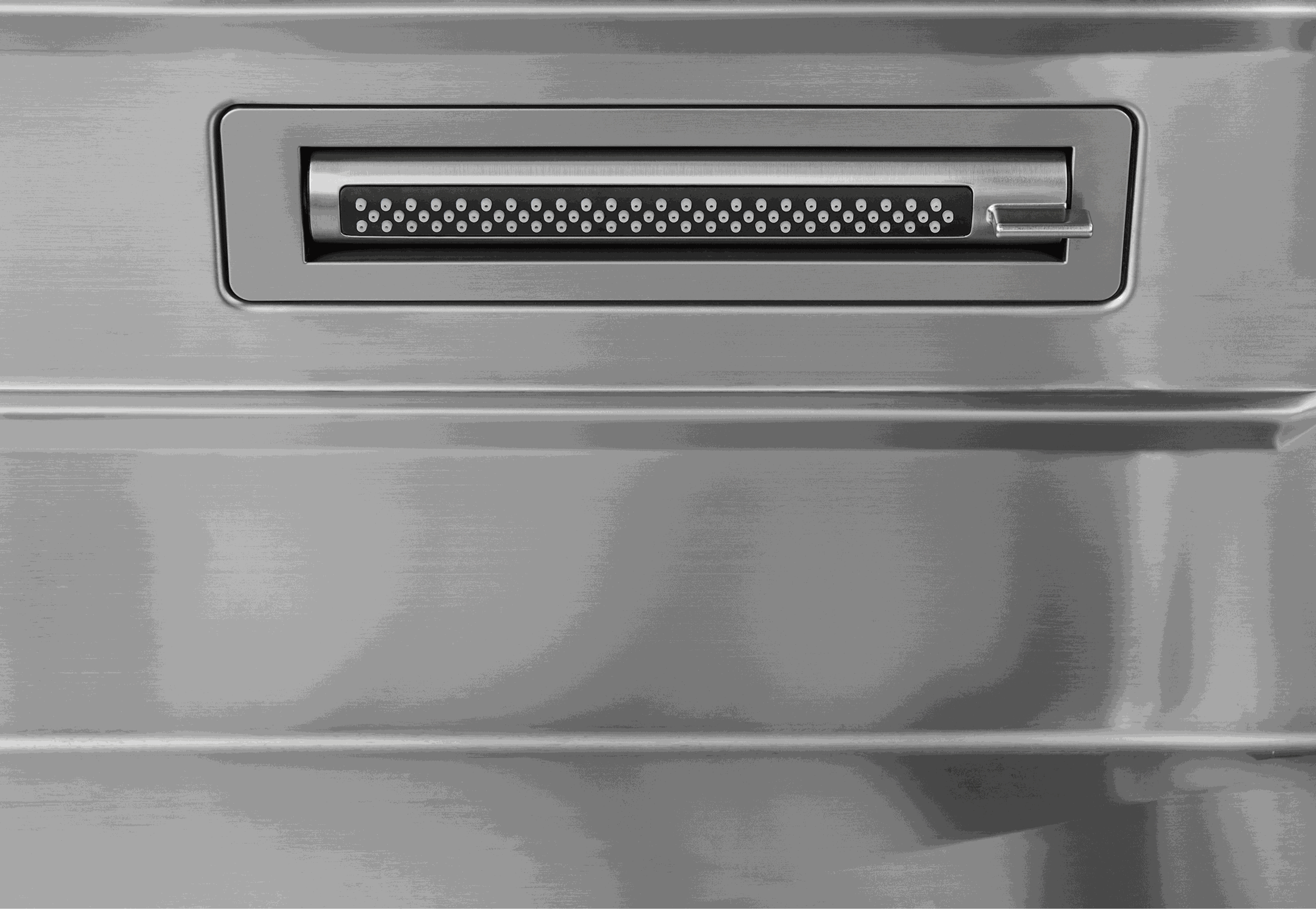 Stainless sink side rinse spray outlet with perforated nozzle panel