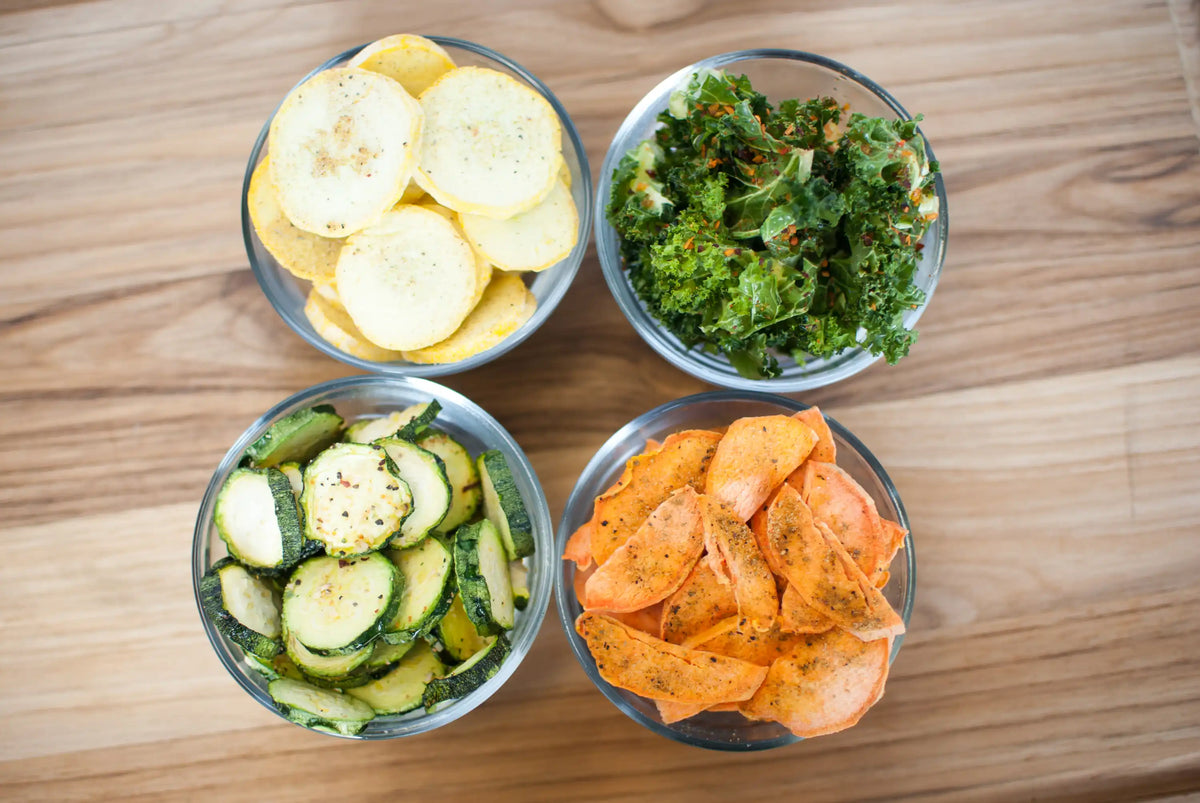 Harvest Right freeze dryer starter: four bowls of sliced fruits and vegetables on a board