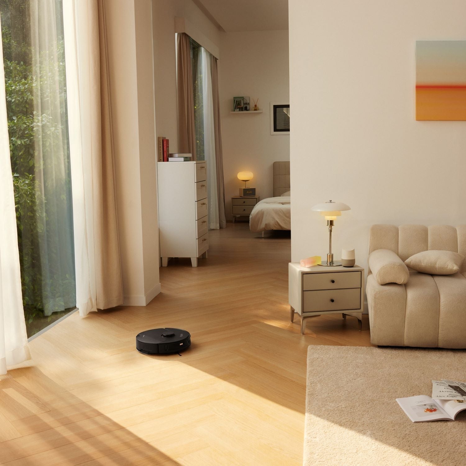 White robot vacuum on hardwood floor, standing alone