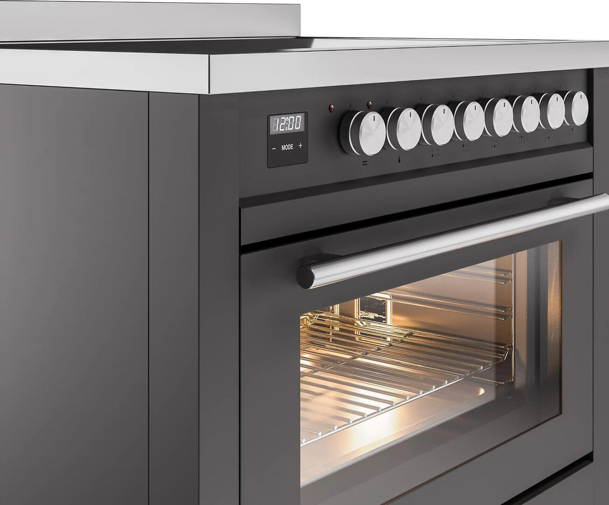 Matte graphite induction range with side control knobs and open oven