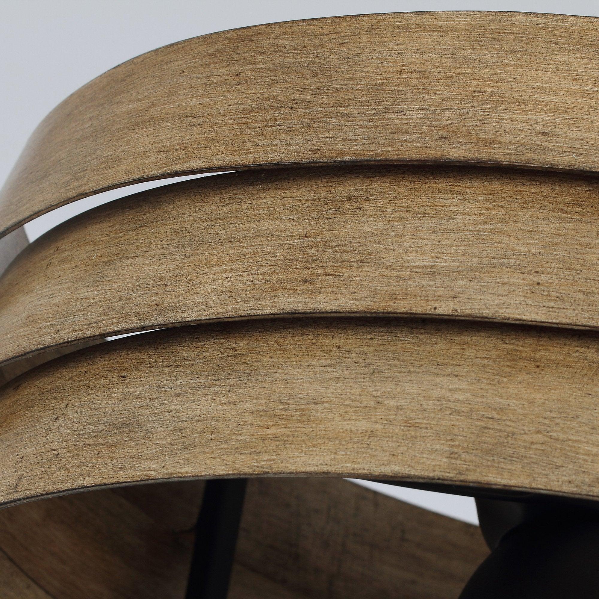 Close-up of brown wood-look drum slats on a flush mount LED ceiling fan