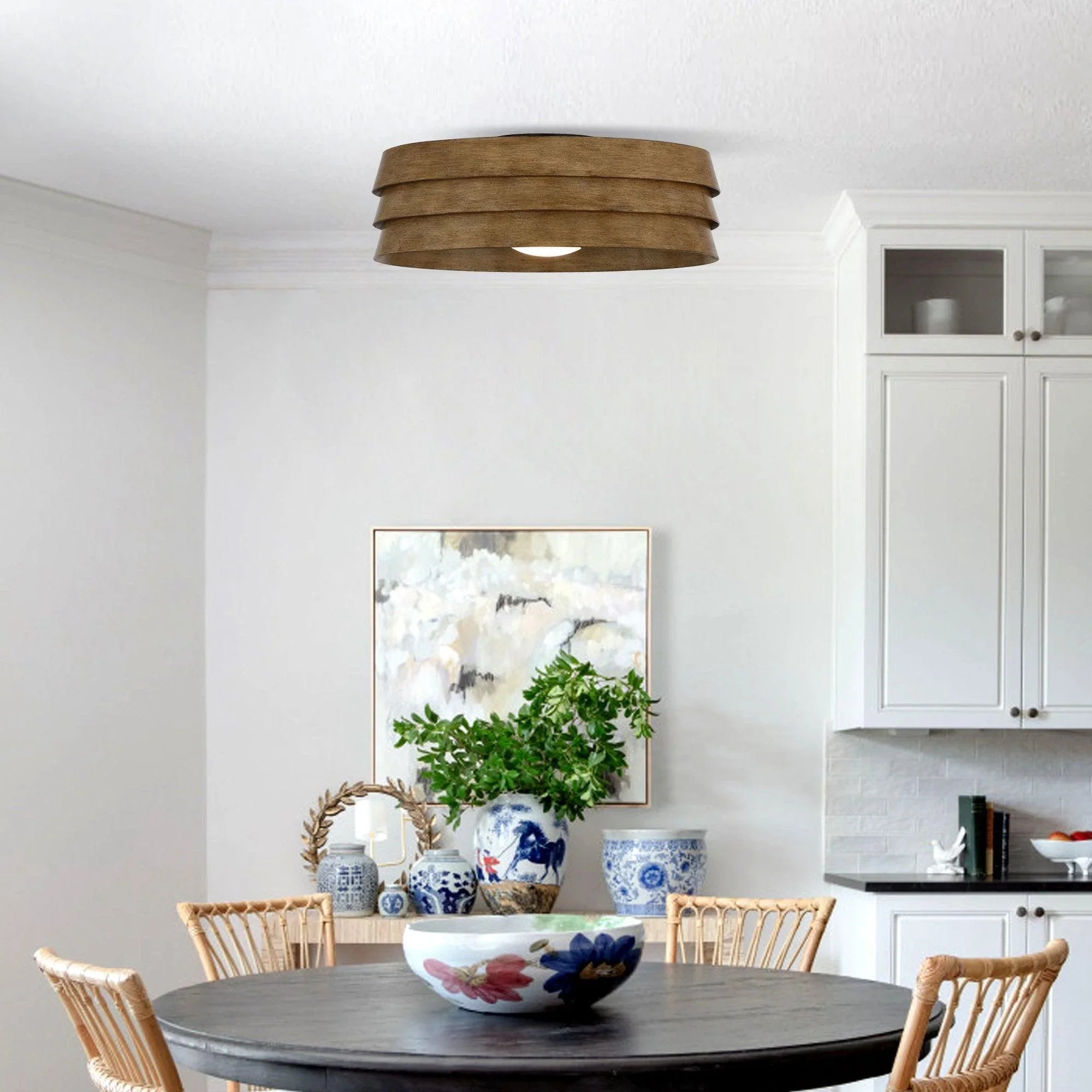 Brown flush mount LED ceiling fan with layered wood-look drum shade on the ceiling