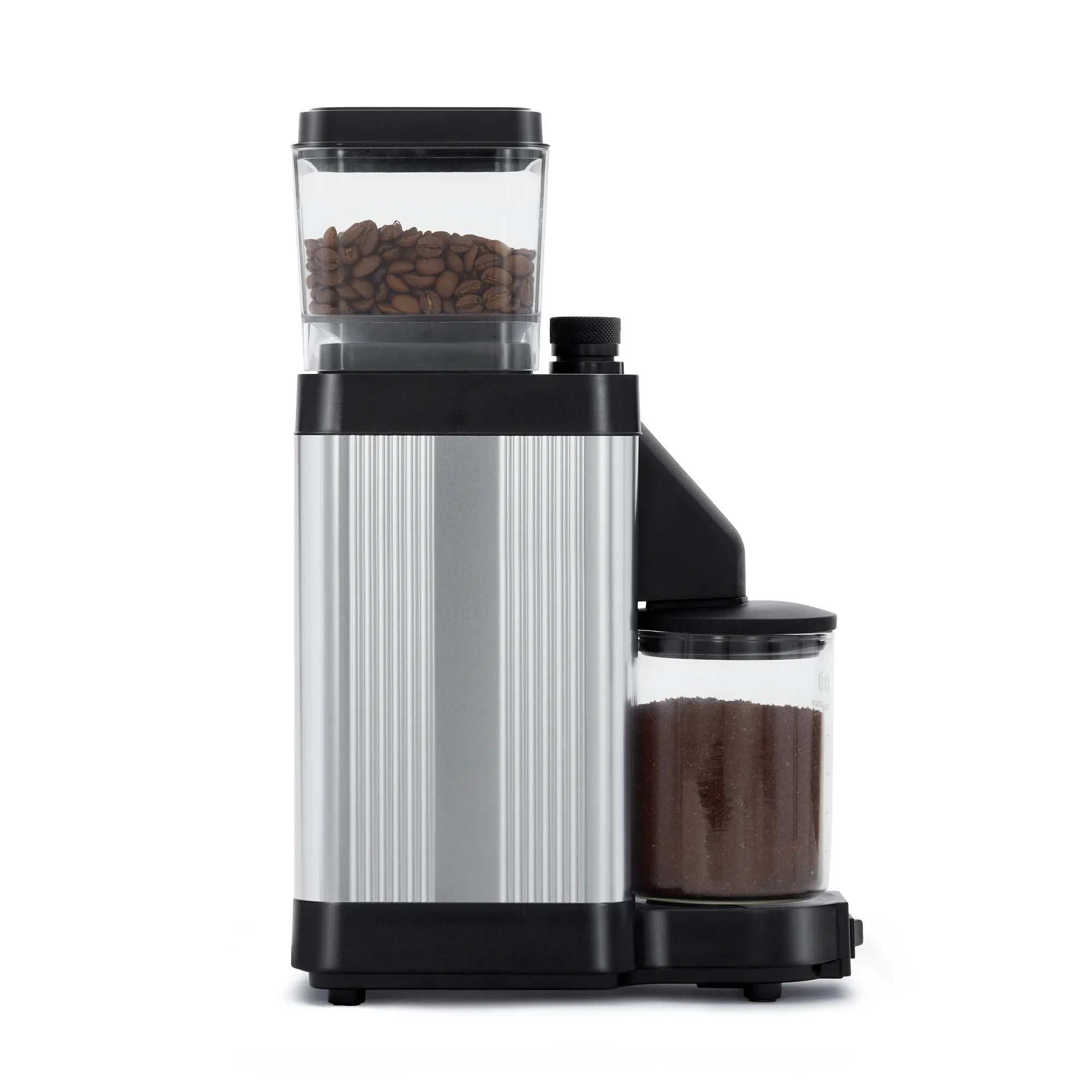 Polished silver burr grinder with clear bean hopper and attached grinding chute