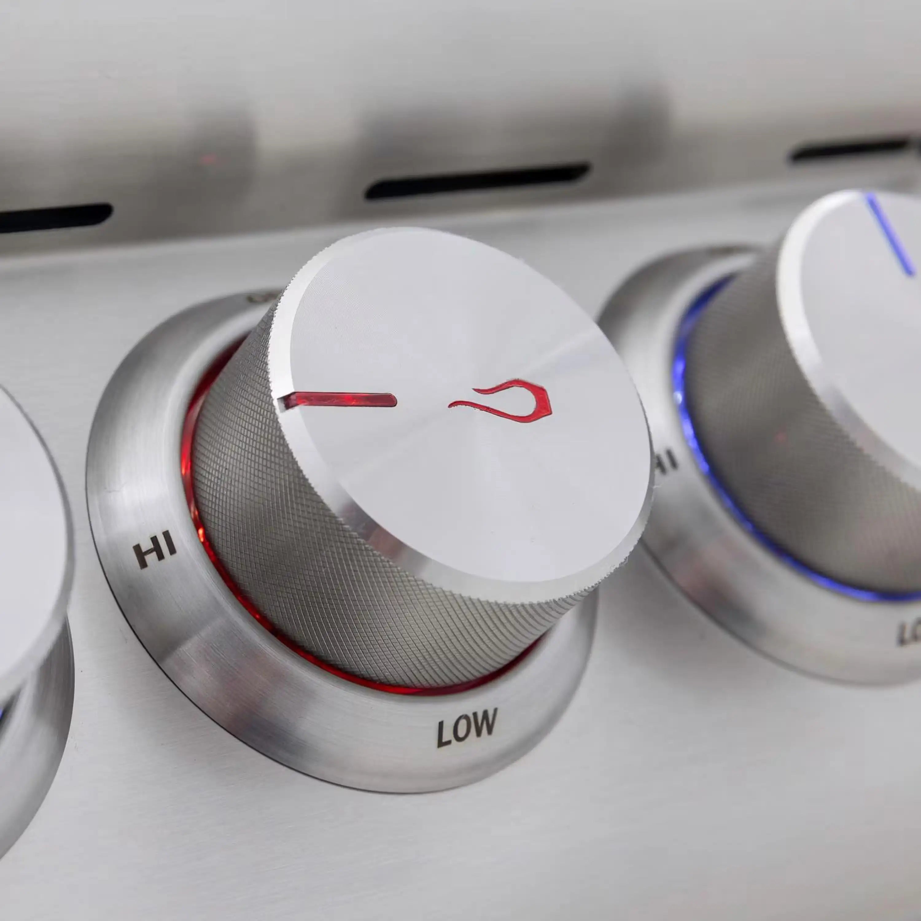 Stainless steel burner control knob on LOW with red indicator on HI ring