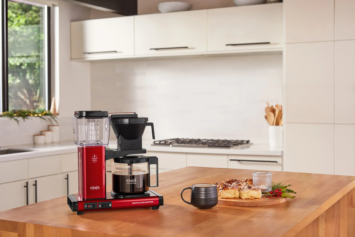 Candy apple red coffee maker with glass carafe and black brew basket cover