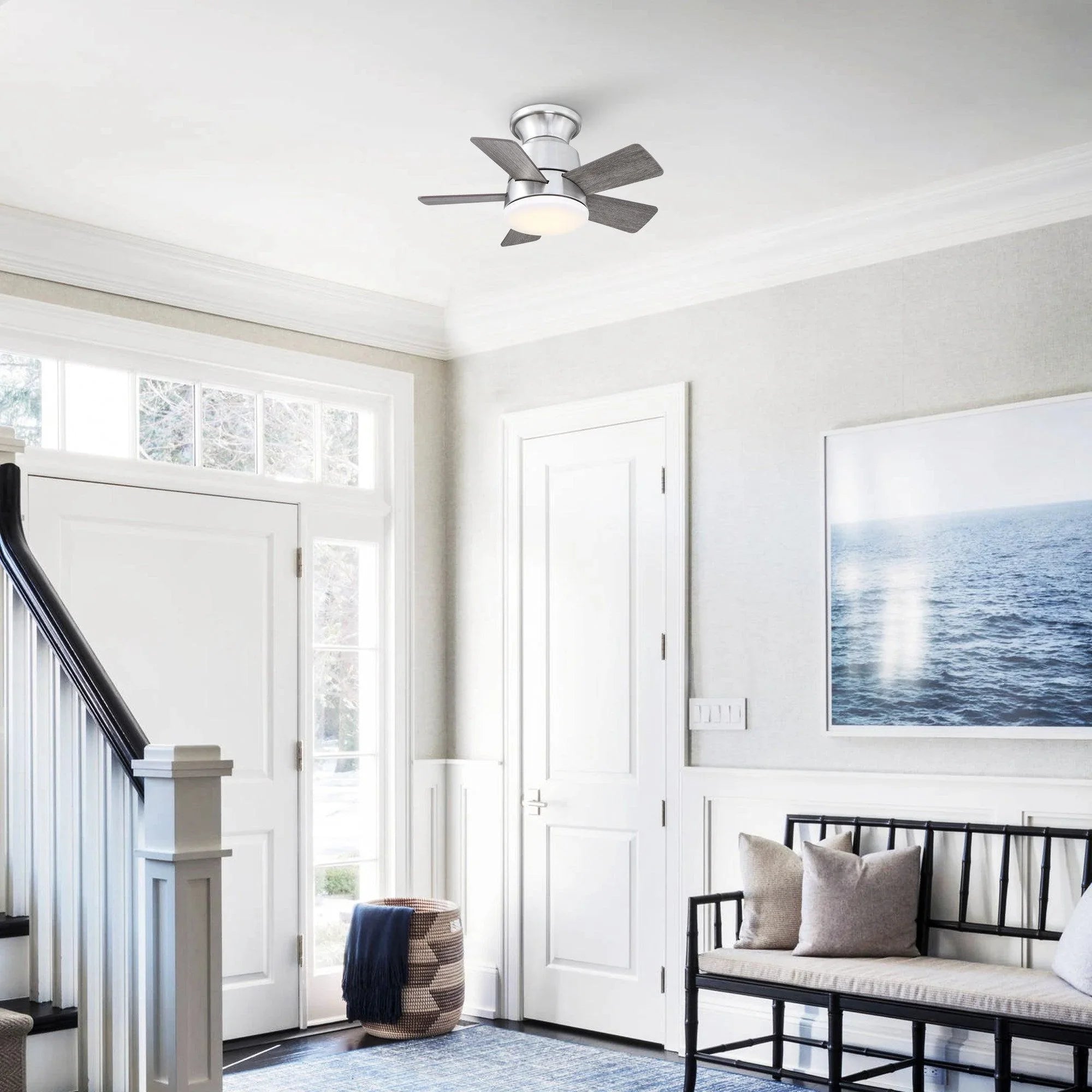Brushed nickel flush-mount ceiling fan with wood blades and frosted light dome