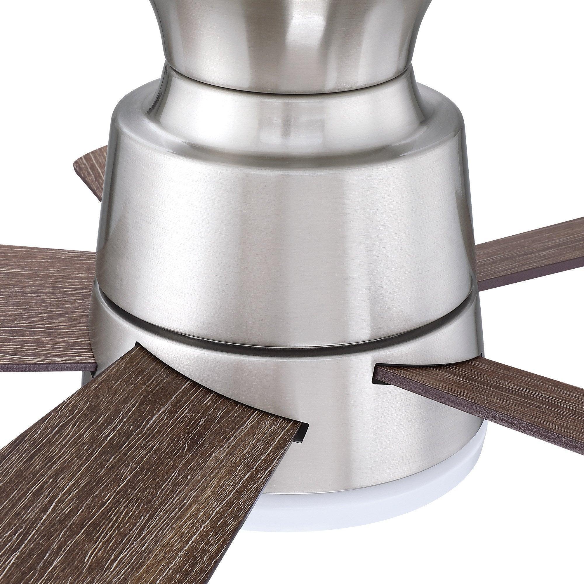 Brushed nickel ceiling fan hub with dark wood-look reversible blade segments and frosted light